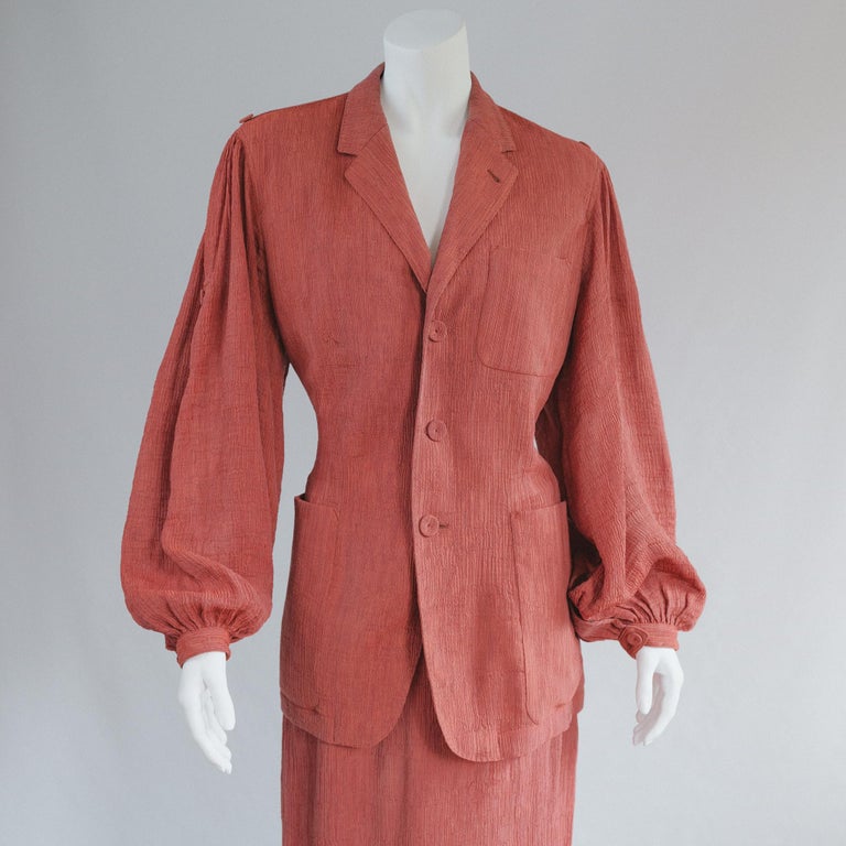 Vintage Jean Paul Gaultier Femme Brick Red Pliss Skirt Suit 
early 90s vintage Iconic and collectible
Dusty red maroon pliss rayon 

Simple blazer with over sized sleeve, full length skirt with beautiful pleated skirt detail. 
Good Vintage