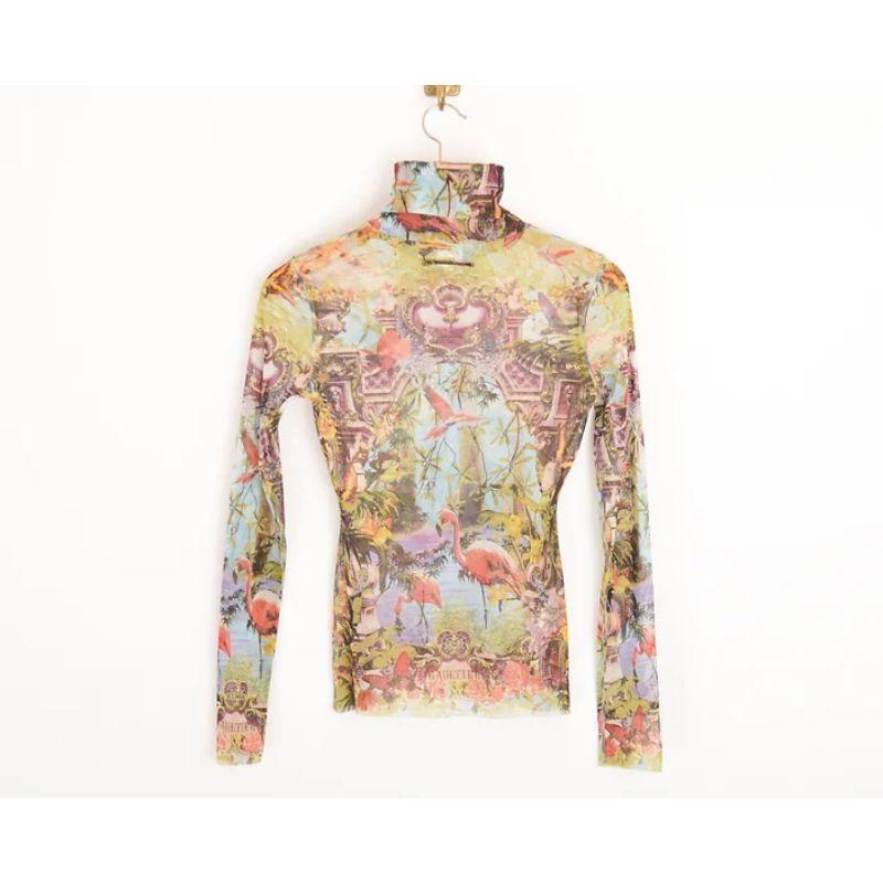 1990's Vintage Jean Paul Gaultier 'FEMME' label micro mesh long sleeved top, depicting beautiful tropical images from Gaultiers Garden of Eden, with 'Gaultier' logo on both front, back and cuffs.

Features:
Long sleeves
Fitted shape
Figure hugging