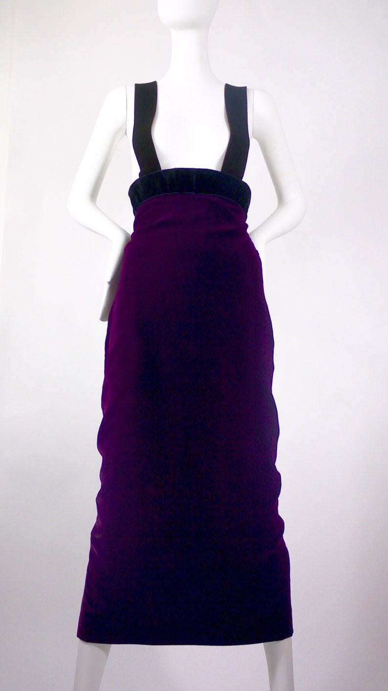 Vintage JEAN PAUL GAULTIER High Waisted Suspender Velvet Skirt Dress

Measurements taken laid flat, please double waist and hips:
High Waist: 14 4/8 inches
Normal Waist: 13 4/8 inches
Hips: 18 4/8 inches
Length: 54 inches
Slit: 12 4/8
