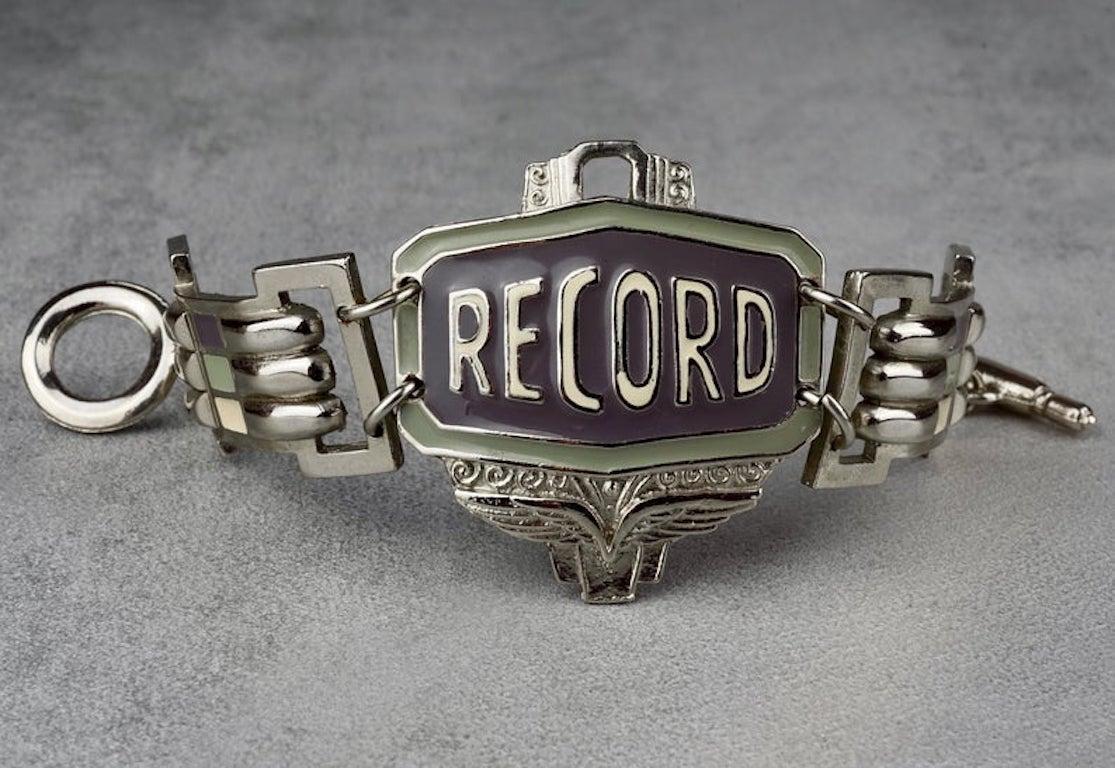 Vintage Jean Paul GAULTIER JPG RECORD Enamel Cuff Bracelet

Measurements:
Height: 2.16 inches (5.5 cm)
Wearable Length: 7.48 inches (19 cm)

Features:
- 100% Authentic JEAN PAUL GAULTIER.
- Enamelled cuff bracelet with RECORD inscription.
- Silver