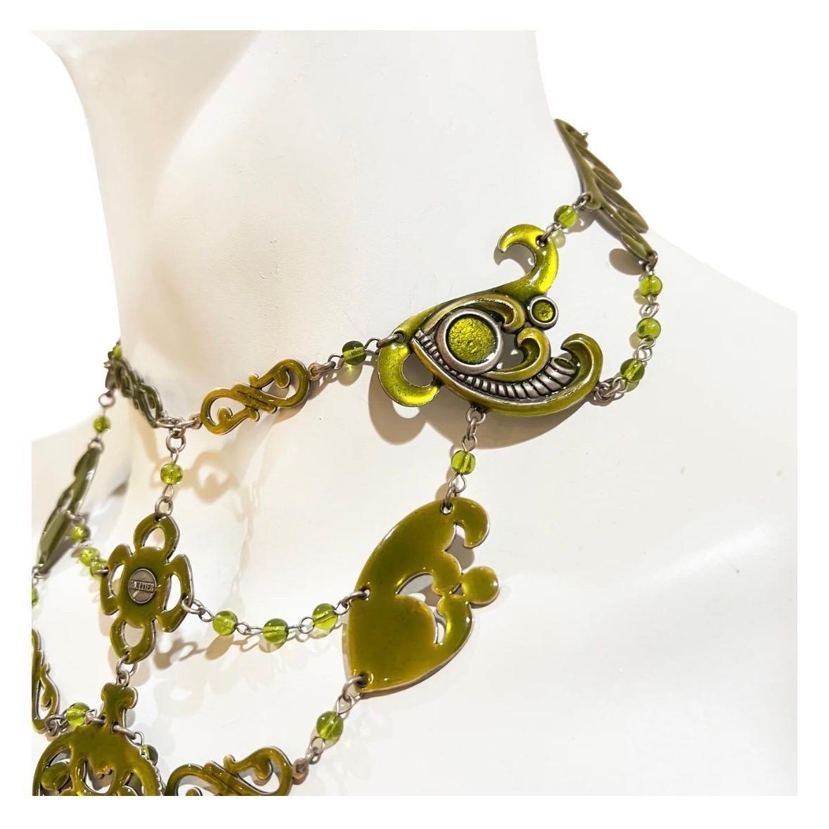 Paisley Cutout Tiered Necklace by Jean Paul Gaultier
Circa 1995
Made in France
Paisley shaped metal pieces covered in chartreuse enamel 
Pieces attached by tiered metal chains with chartreuse beads 
Adjustable length 
Lobster claw clasp closure