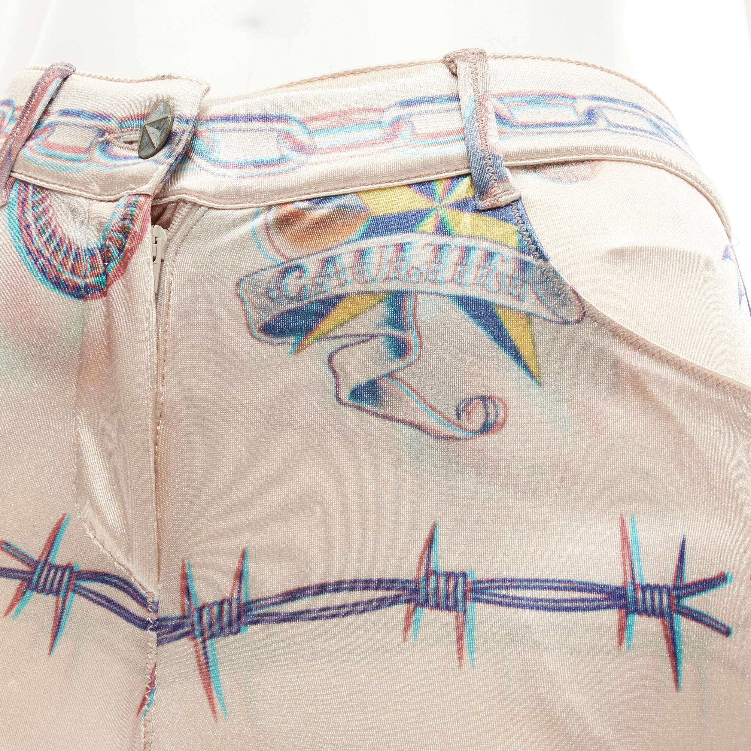 vintage JEAN PAUL GAULTIER Punk Tattoo print polyamide skinny pants FR34 US4 S 
Reference: TGAS/B02254 
Brand: Jean Paul Gaultier 
Material: Polyamide 
Color: Beige 
Pattern: Tattoo print 
Closure: Button 
Extra Detail: Antique blue-tone metal star