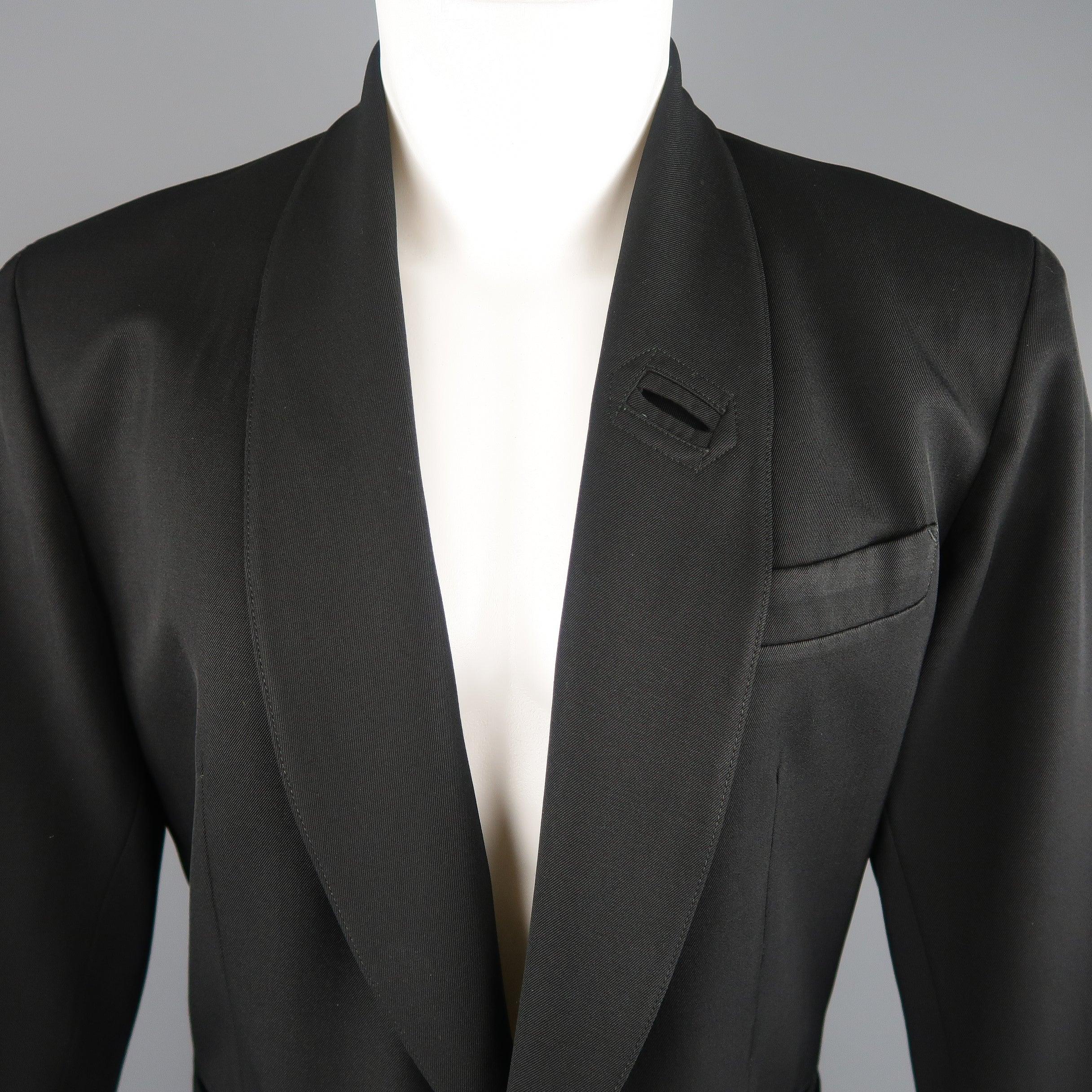 Vintage 1980's JEAN PAUL GAULTIER pour GIBO sport coat comes in black wool blend twill with a shawl collar, two button single breasted front, patch and slit pockets, and signature back tab. Circa 1985. Made in Italy.
 Excellent Pre-Owned Condition.
