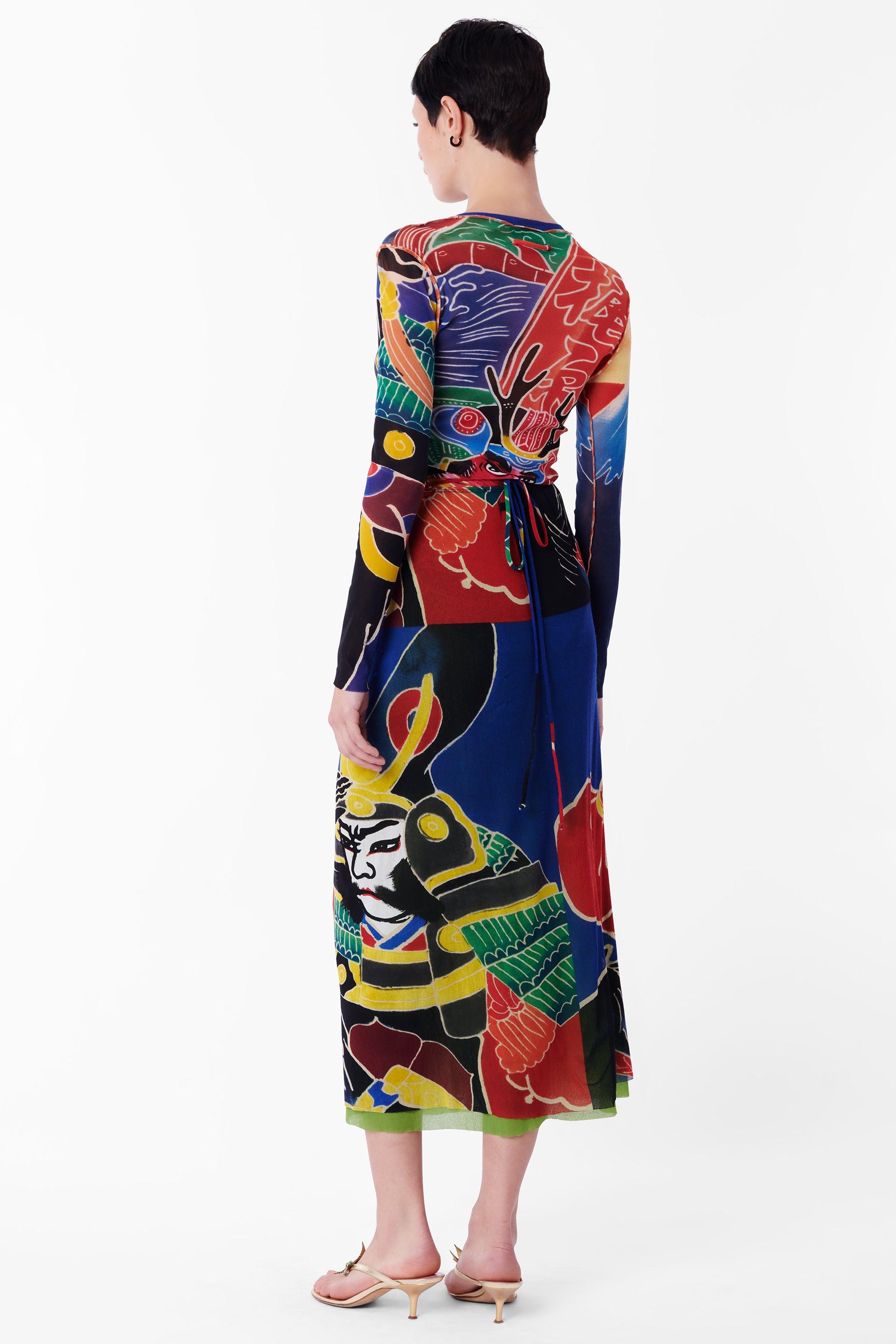 Vintage Jean Paul Gaultier Spring Summer 1999 Kabuki print mesh co-ord set. Features the iconic Kabuki print covering a long sleeve mesh top and double lined sarong style skirt with open leg and tie-up waist. In excellent vintage condition.

Brand: