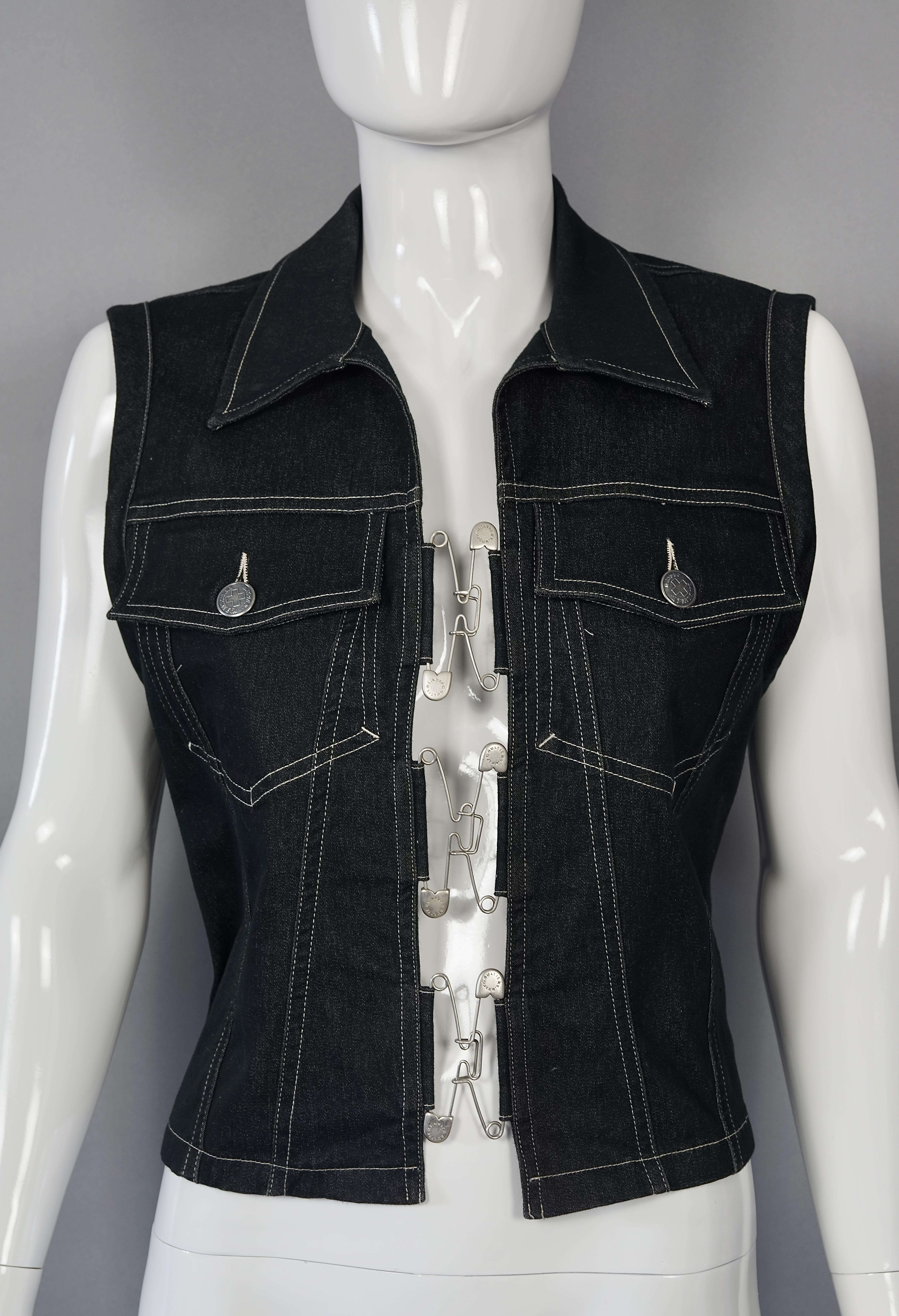 Vintage JEAN PAUL GAULTIER Safety Pin Denim Vest Jacket

Measurements taken laid flat, please double bust and waist:
Shoulder: 15.35 inches (39 cm)
Bust: 18.50 inches (47 cm)
Waist: 16.92 inches (43 cm)
Length: 21.25 inches (54 cm)

Features:
- 100%