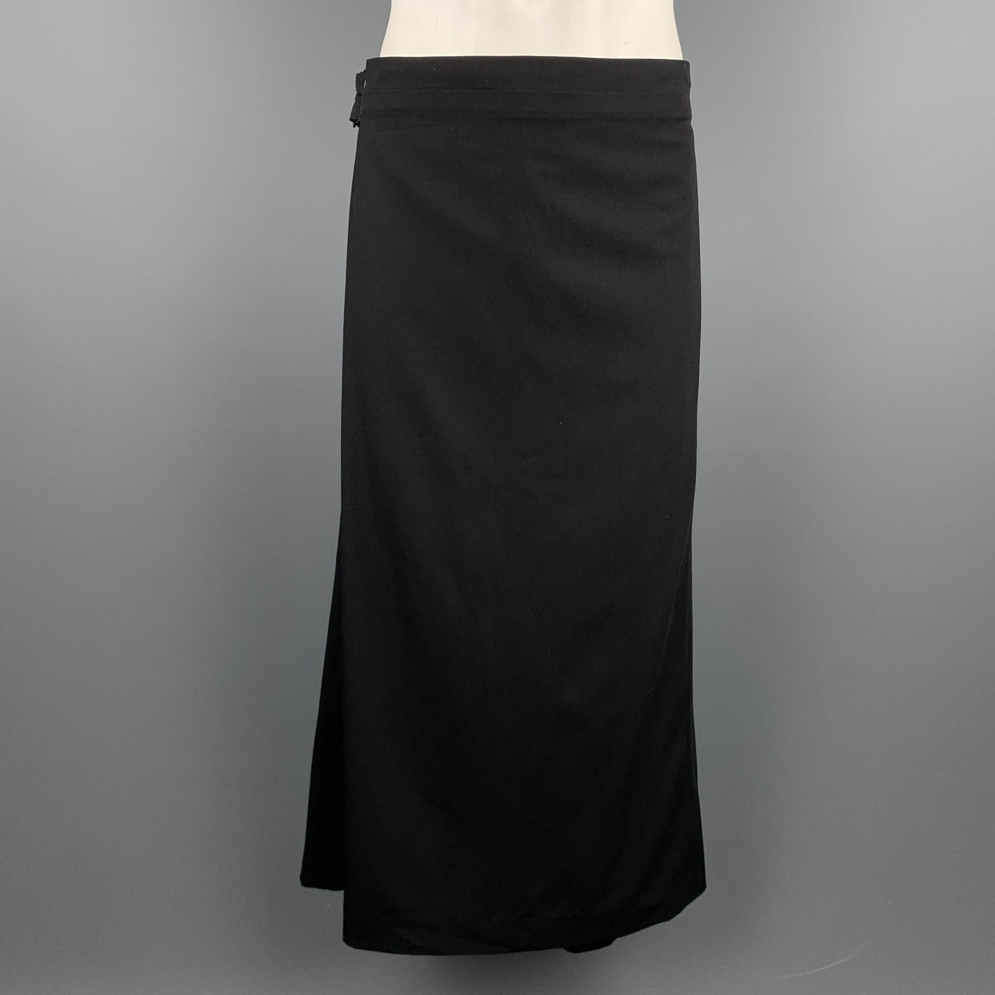 Vintage JEAN PAUL GAULTIER dress pants comes in a black wool featuring a back apron design, mid rise, waistband with belt loops, strap closure, side pockets, wide leg, back rear pleat, and a zip fly closure. Made in Italy.

Very Good Pre-Owned