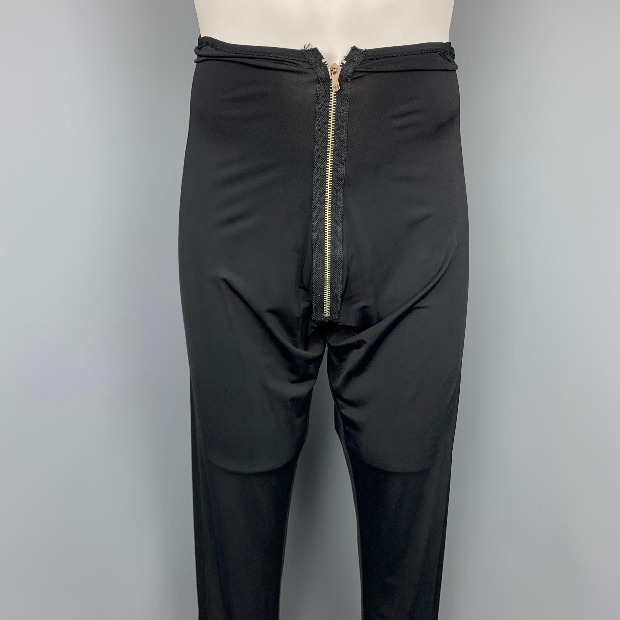 Vintage JEAN PAUL GAULTIER leggings comes in a black polyamide featuring a front zipper closure. Made in Italy.

Good Pre-Owned Condition.
Marked: IT 52

Measurements:

Waist: 28 in.
Rise: 13 in.
Inseam: 30 in. 