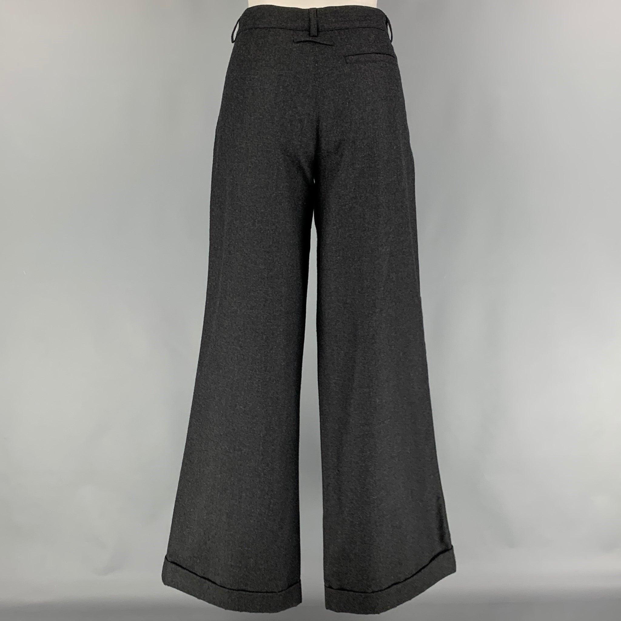 Vintage JEAN PAUL GAULTIER pants comes in a grey virgin wool featuring a wide leg, front patch pockets, front tab, and a zip fly closure.
Very Good
Pre-Owned Condition. 

Marked:   8 

Measurements: 
  Waist: 32 inches  Rise:
10 inches  Inseam: 33.5