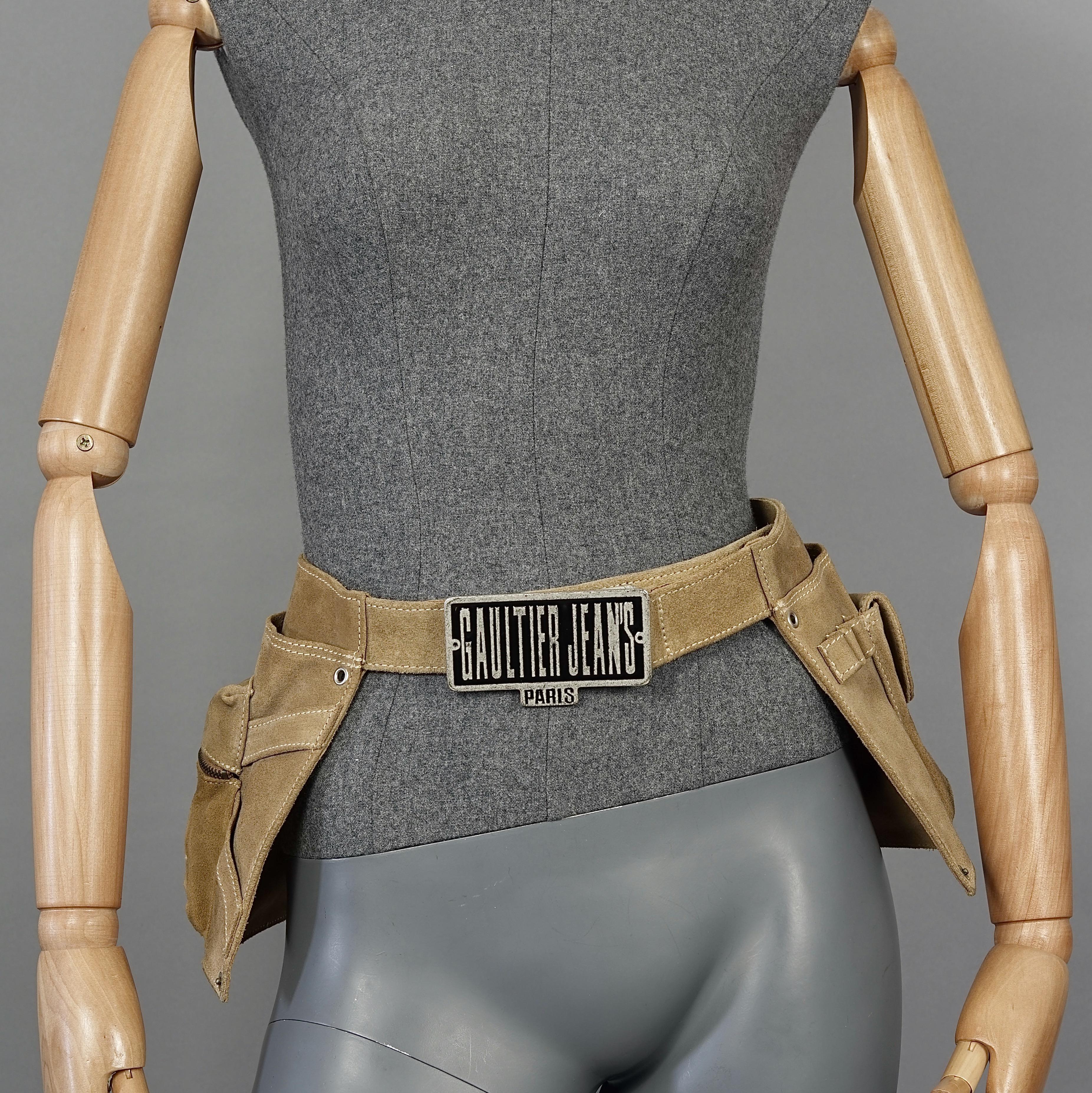 Vintage JEAN PAUL GAULTIER Utility Suede Leather Fanny Belt Bag

Measurements:
Height: 8.26 inches (21 cm)
Wearable Length: 28.74 inches to 35.82 inches (73 cm to 91 cm).

Features:
- 100% Authentic JEAN PAUL GAULTIER.
- Brown suede leather utility