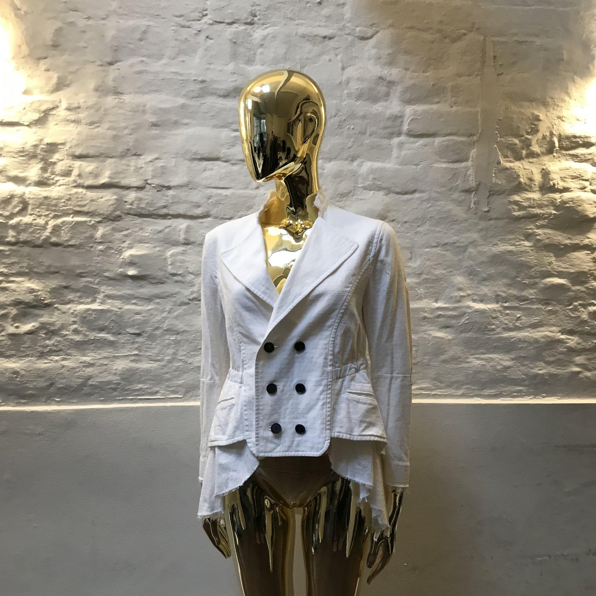 Vintage Jean Paul Gaultier White Cotton Ruffle Jacket made in France. 

Jean Paul Gaultier disrupted the rarefied world of couture with his transgressive vision of beauty.

Inspired by punks, burlesque, screen goddesses, gender-benders, fetishists