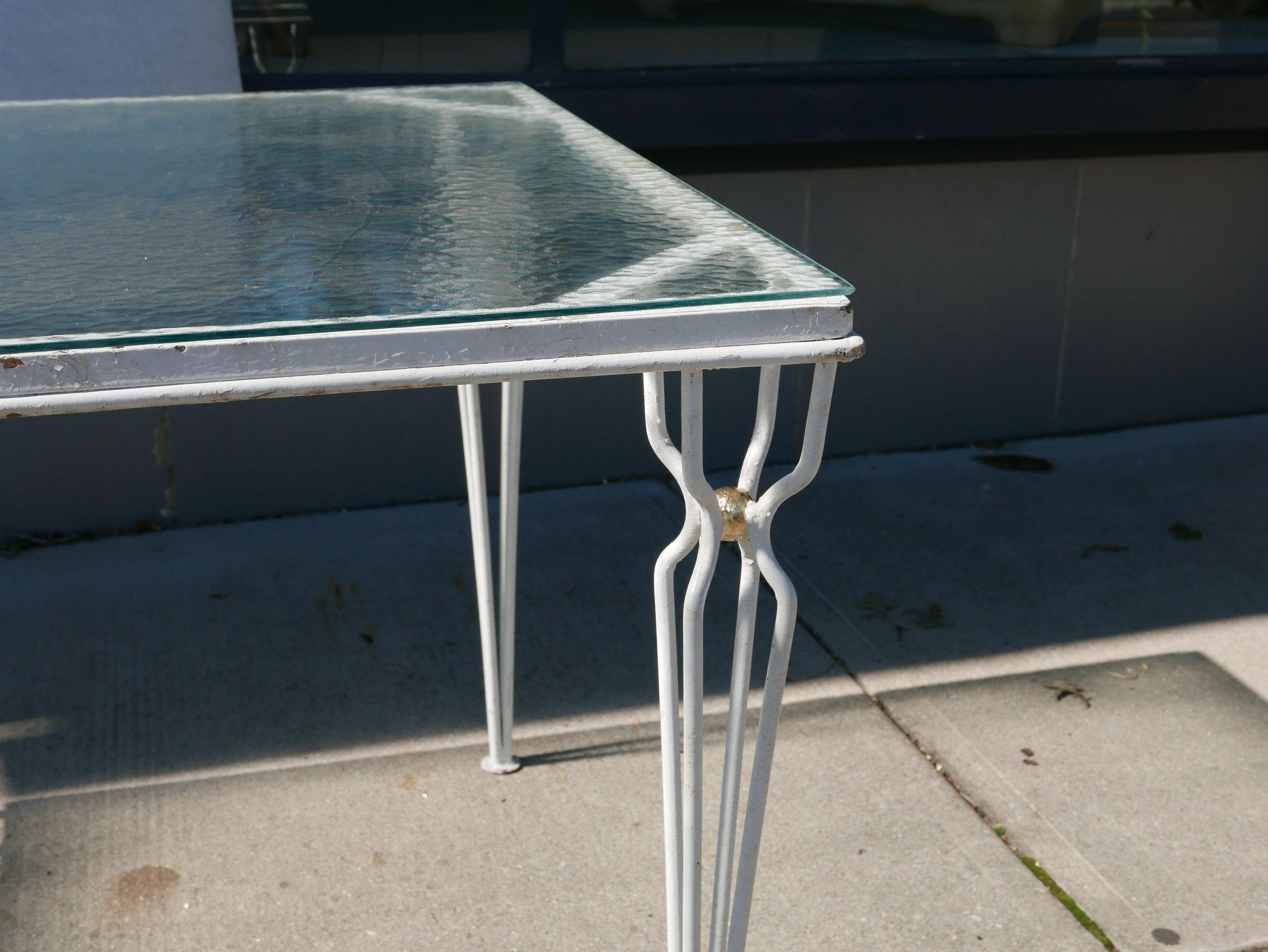 Stunning 1950s Jean Royere style table. Great style with vintage hammered glass textured top that is tempered.