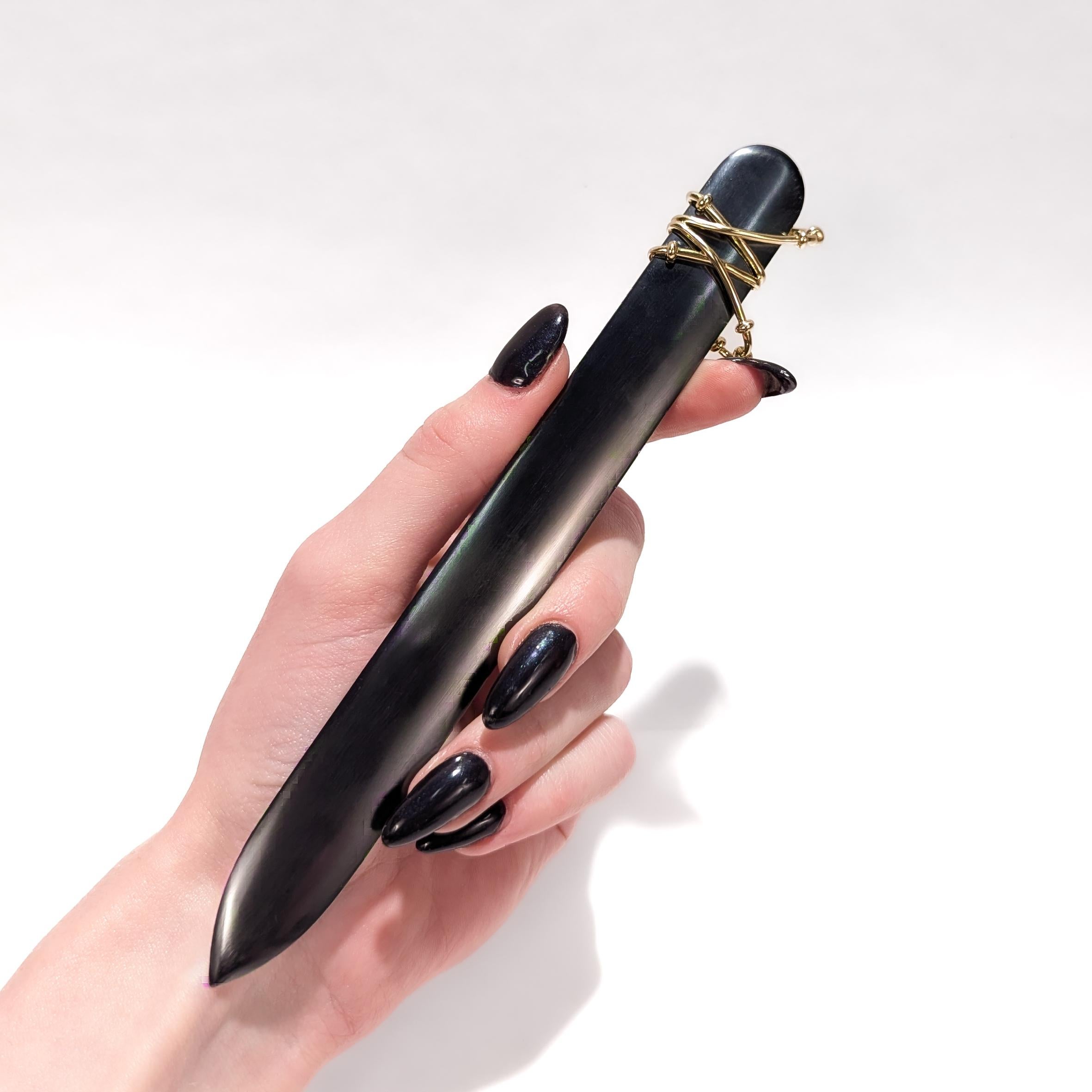 A fine vintage letter opener.

Designed by Jean Schlumberger for Tiffany & Co.

With a lustrous hematite blade and an applied 18 karat yellow gold wirework handle.

Marked to handle.

Simply a wonderful Tiffany Schlumberger design!

Date:
20th