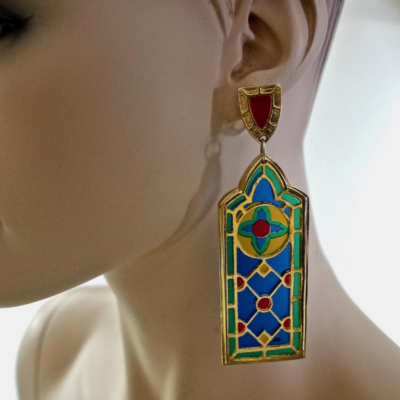 Vintage JEAN XAVIER DUHART Cathedral Stained Glass Window Earrings

Measurements:
Height: 3.77 inches (9.6 cm)
Width: 1.22 inches (3.1 cm)


Features:
- 100% Authentic JEAN XAVIER DUHART.
- Cathedral stained glass window novelty earrings.
- Gold