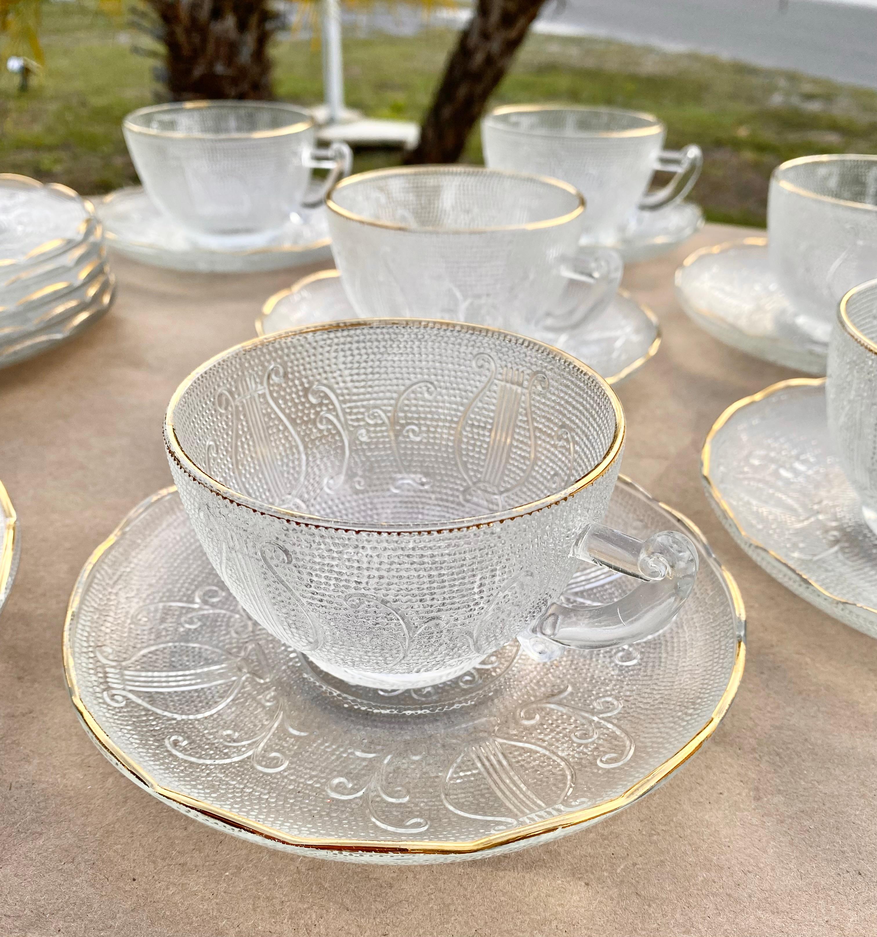 A beautiful collection of six Jeannette Glass cups, saucers and six dessert plates in the Harp pattern. Harp looks like older glass but was made for only a few years in the mid 50's: 1954 to 1957. It fits its name, with a harp design pressed on a