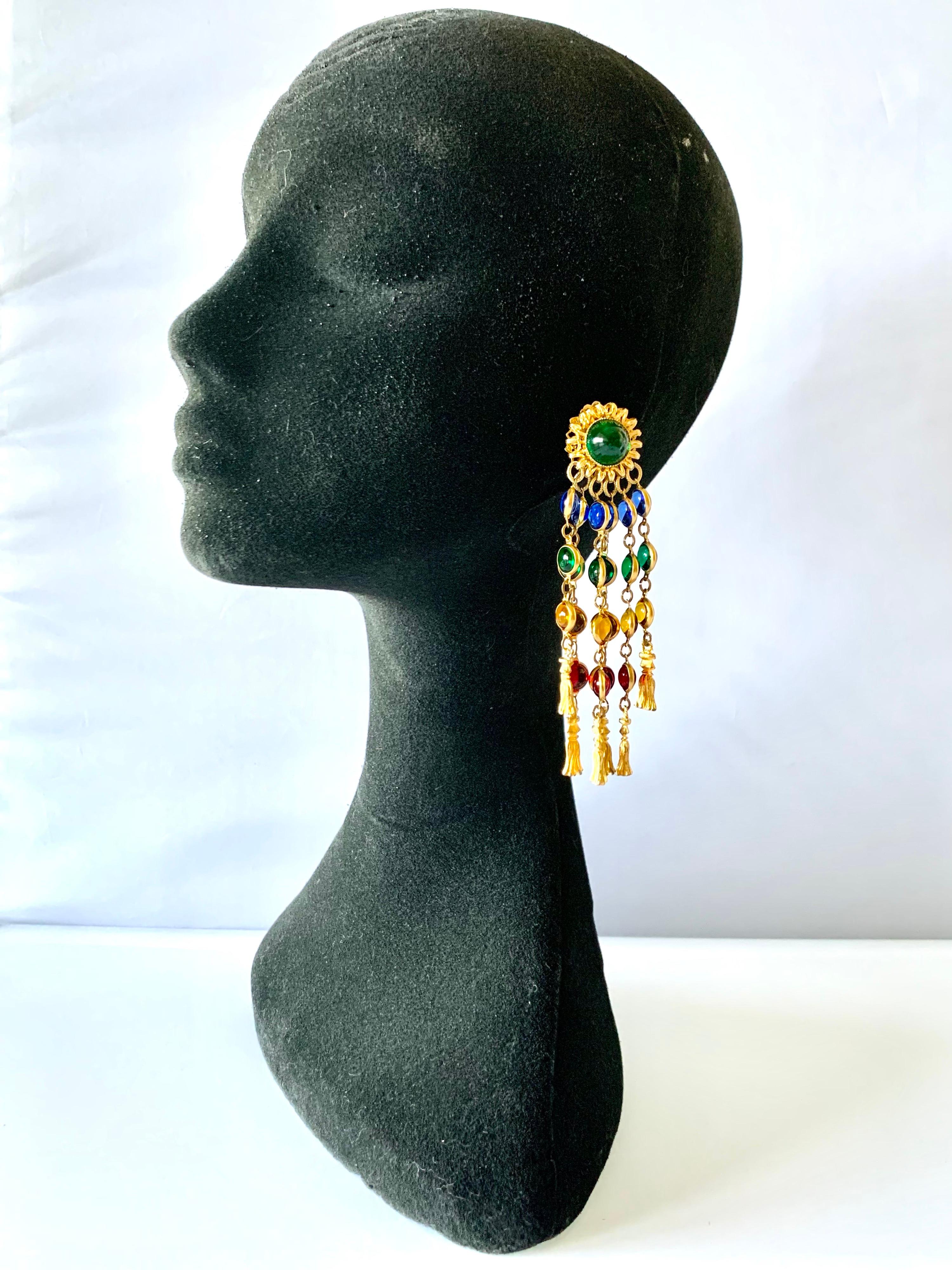Vintage jeweled clip-on tassel statement earrings comprised out of gilt metal, and blue, green, red, and yellow French glass 