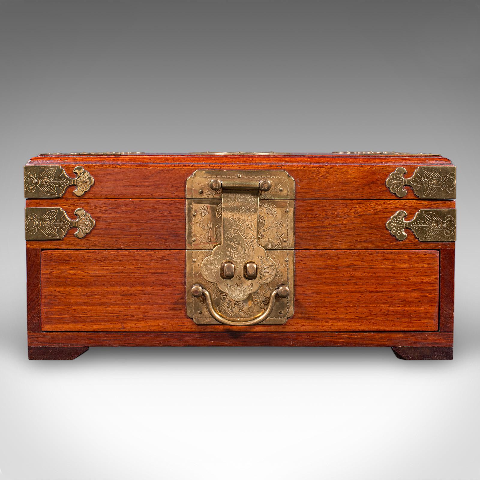 This is a vintage jewellery box. An Oriental, mahogany and brass keepsake case, dating to the late 20th century, circa 1970. A finely presented storage box with excellent decorative appeal and practical interior arrangement.

Delightful vintage
