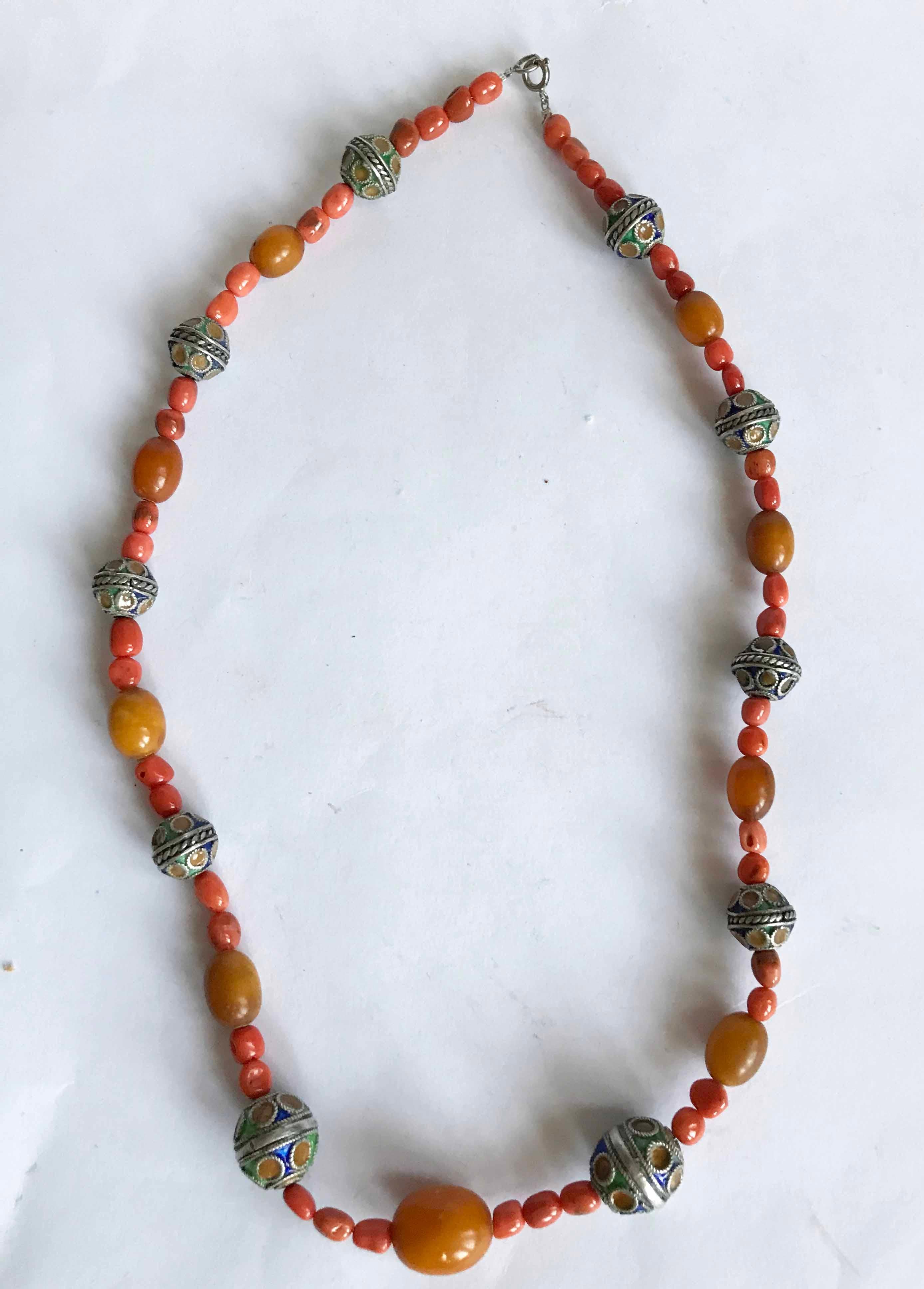 Vintage Kabyle Berber tribal silver enamel coral necklace.

A beautiful  vintage enamelled tribal silver and coral necklace from the kabyle Berber people of Algeria.

High grade silver with enamel and amber beads with antique coral.

Measure: