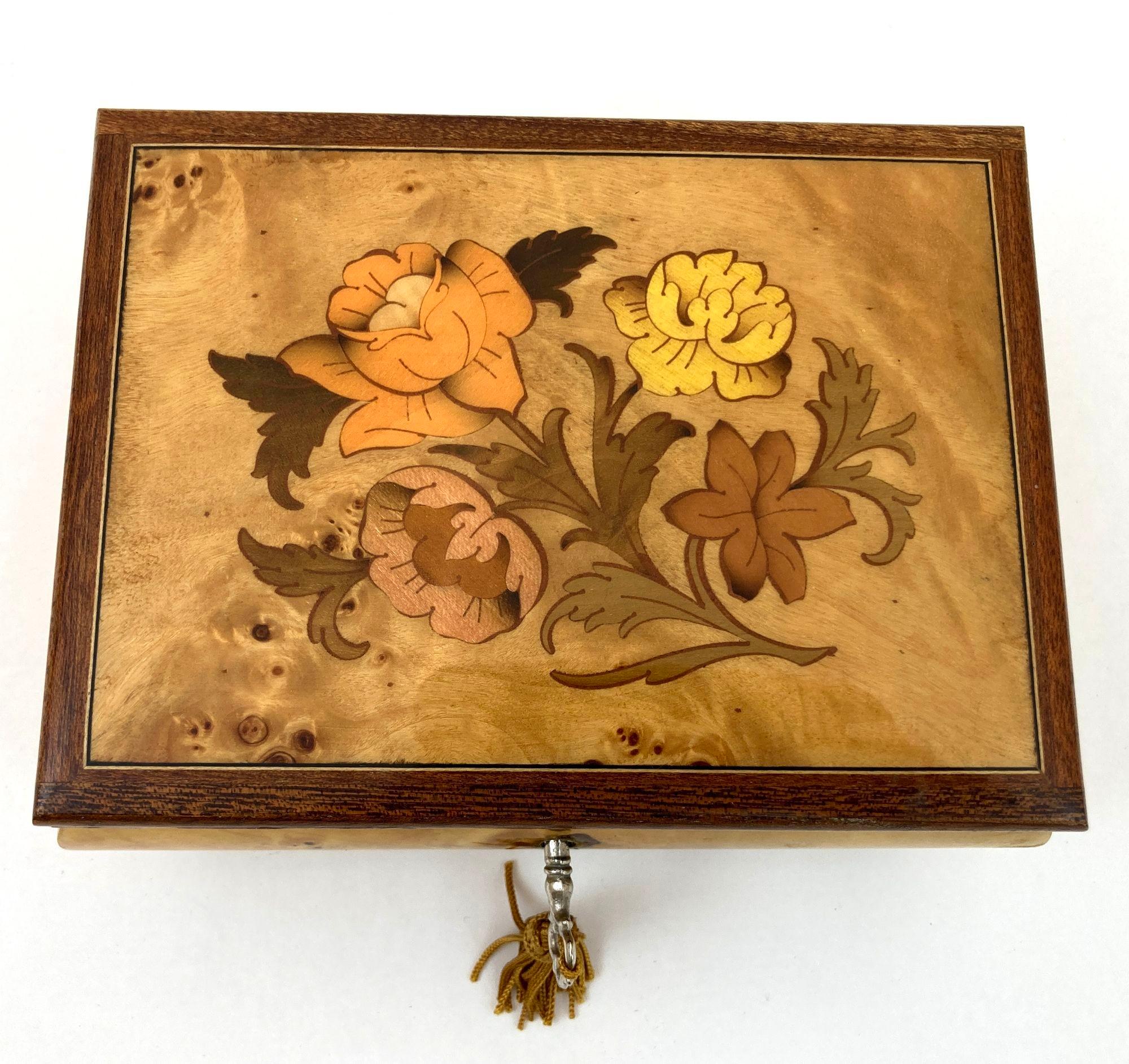 Vintage Italian large footed music box in light gold color with top finely hand painted and wood inlaid with foliages floral decor, brass hardware.
Small Vintage Italian handcrafted wooden Jewelry box.
Upon opening, the music box begins to play