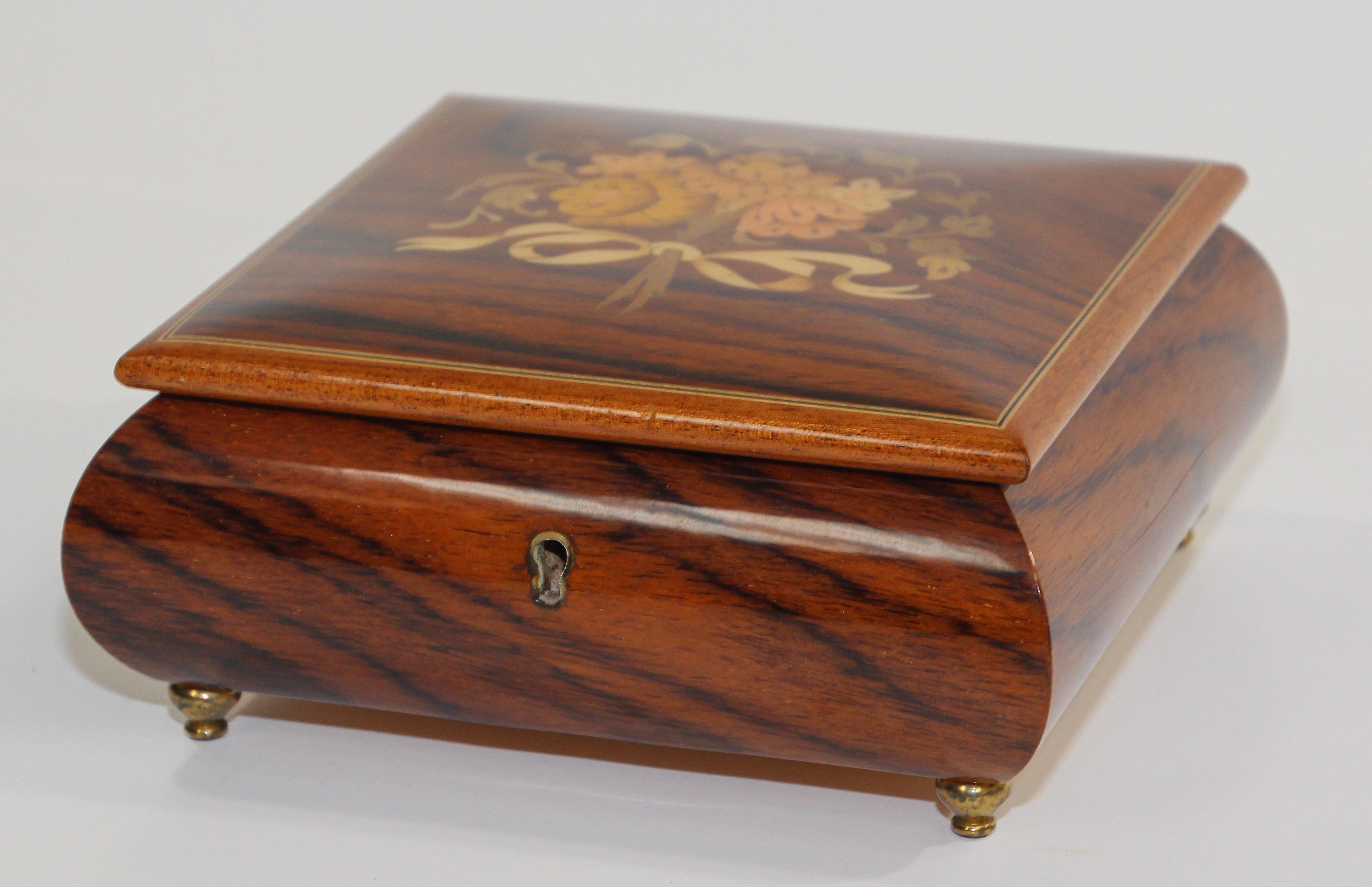 Elegant footed wooden box in thuya wood.
Thuya tree is famous for rich gold and brown shades of its grain and unique exotic fragrance, similar to cedar.
Elegant large vintage footed wooden decorative box with top finely hand painted and inlaid with