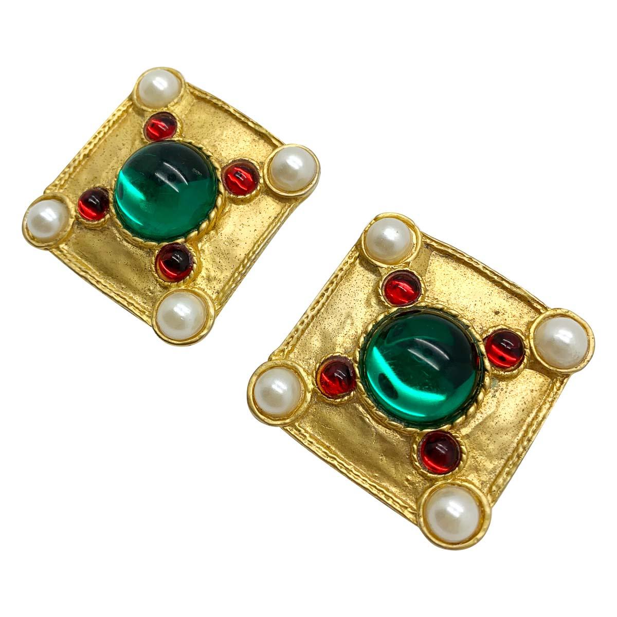 A mesmerizingly fabulous pair of vintage Jewels of Tanjore earrings. Inspired by the opulence of Tanjore jewellery these earrings feature the lavish colours of ruby and emerald upon a rich gold background and finished to perfection with whole pearls