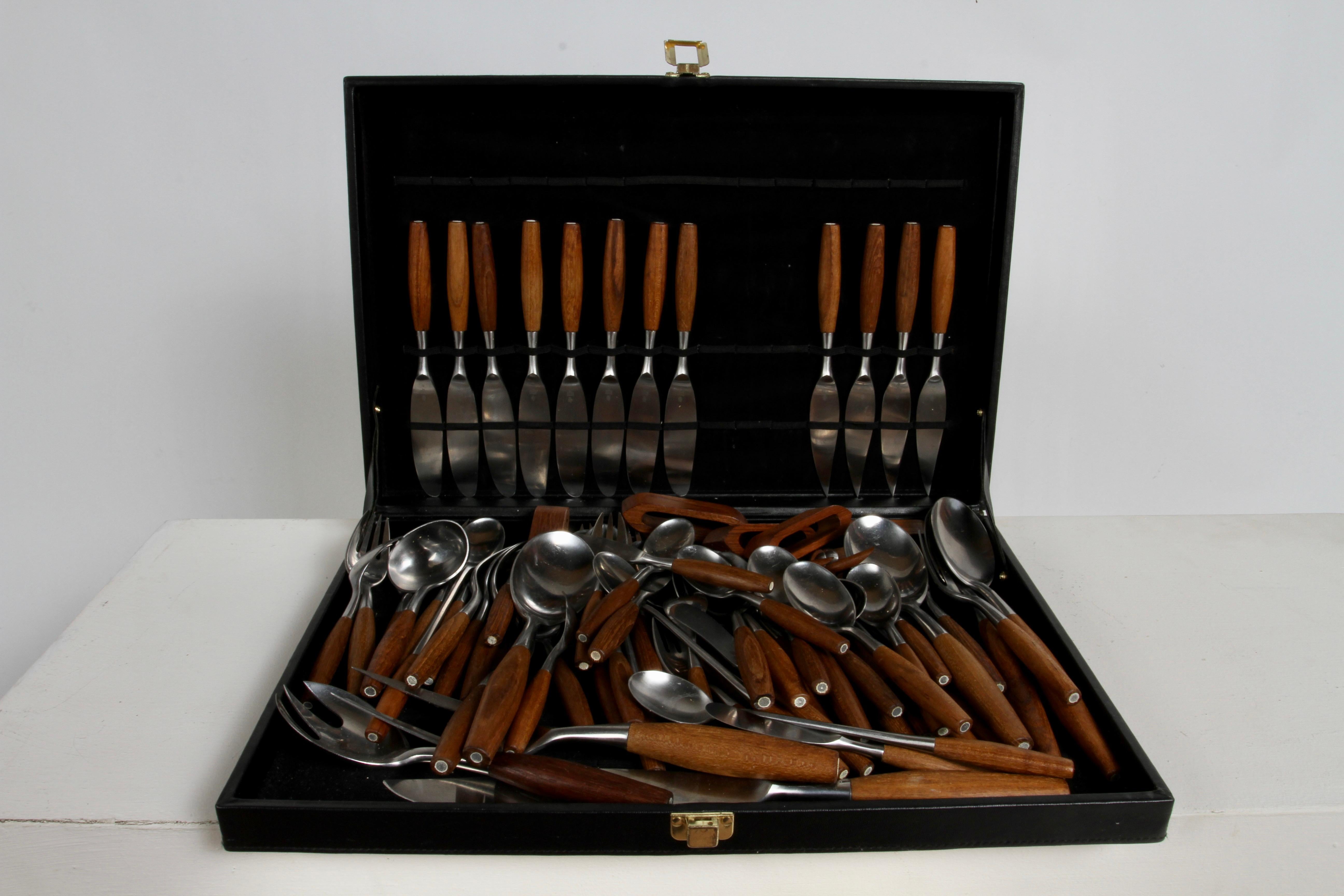 1960s Dansk Designs Danish modern designed by Jens H Quistgaard Fjord flatware service set for 8 includes 92 pieces and case.
Constructed in teak and stainless steel. Marked Dansk Designs Germany JHQ. Original vintage unrestored condition, one