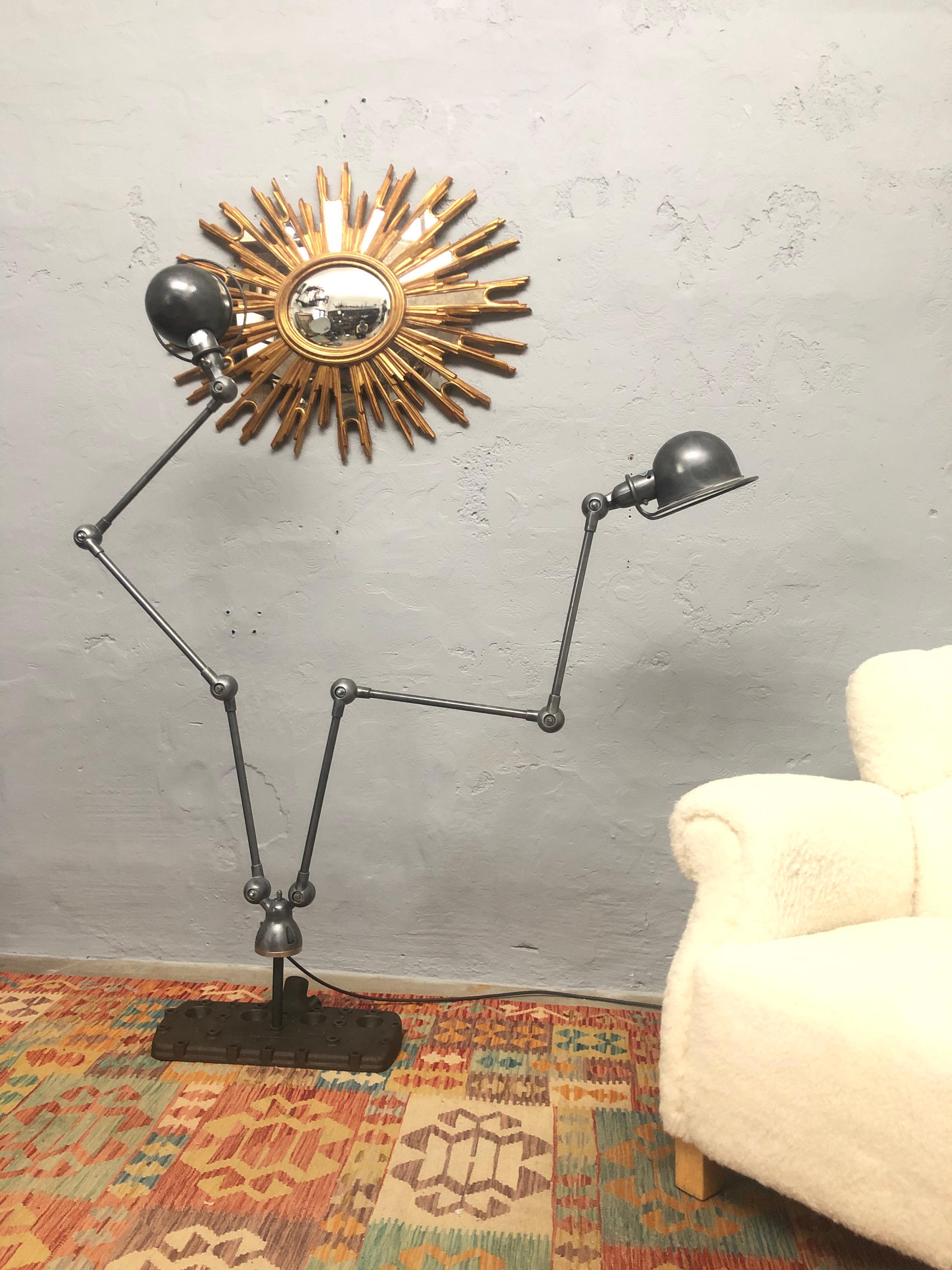 An iconic double arm mid century industrial work lamp by Jielde. 
This industrial lamp is mounted onto a vintage V8 cylinder head. 
Each arm has 3 sections of 40cm per section. 
Each shade with its own on/off switch.
This is not just a lamp it is a
