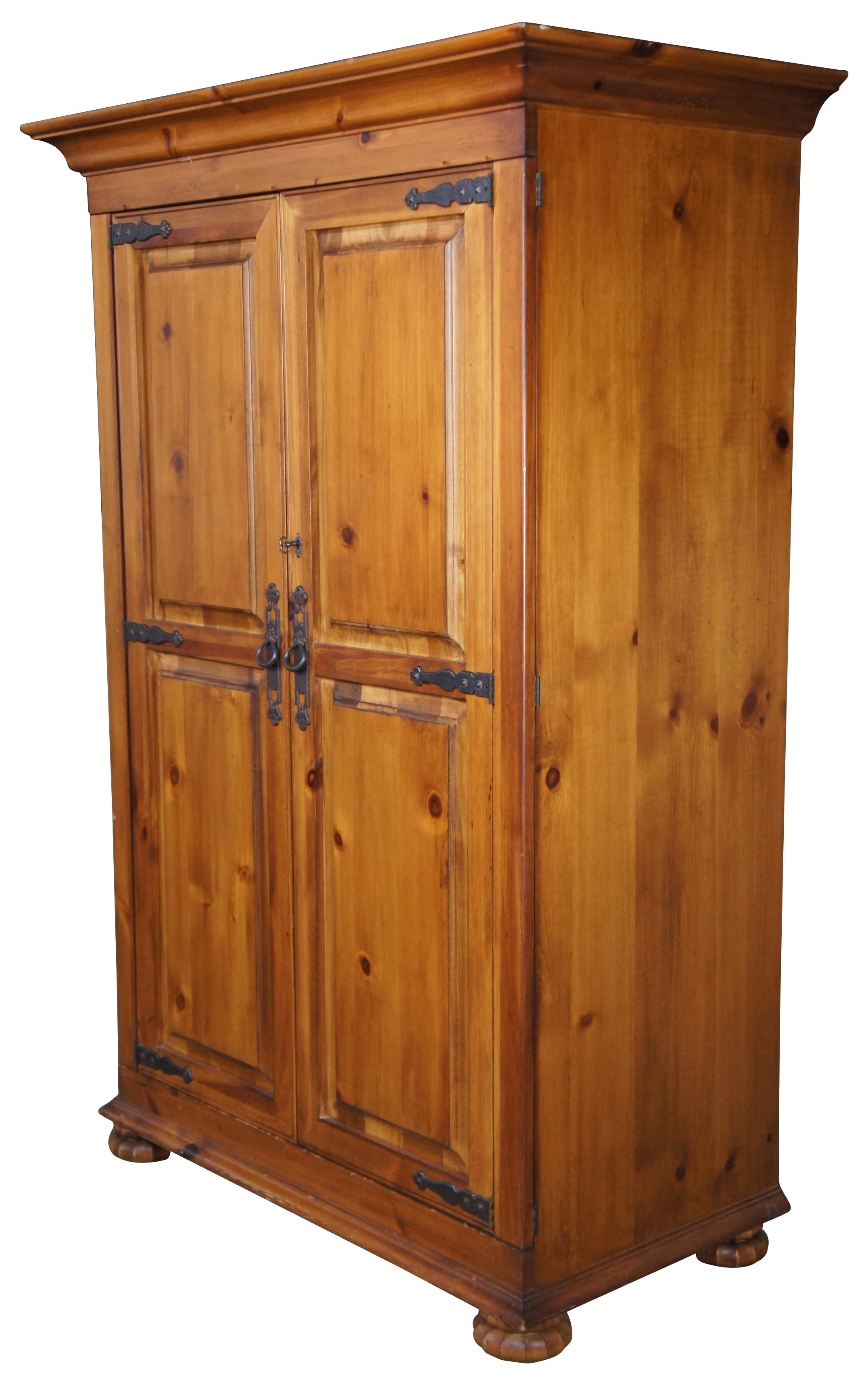 Vintage Jim Peed for Romweber furniture TV entertainment cabinet or armoire. Made of pine featuring iron hardware with paneled doors, round scalloped feet and double hinged doors. Measure: 81