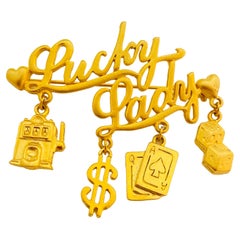 Vintage JJ matte gold LUCKY LADY money casino gambling brooch