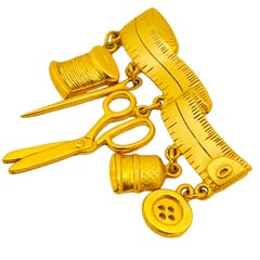 Vintage JJ seamstress gold designer runway brooch