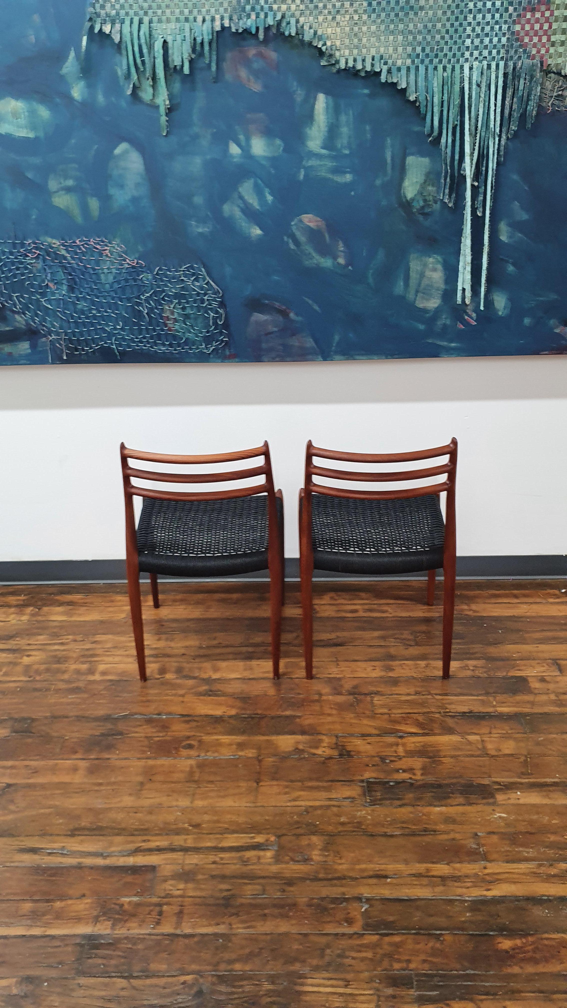 Beautiful pair moller chairs, model 78 with new black danish cord. These chairs have been refinished and reoiled. There are some scratches and gouges in parts of the wood that give the excellent vintage patina while having the benefits of being