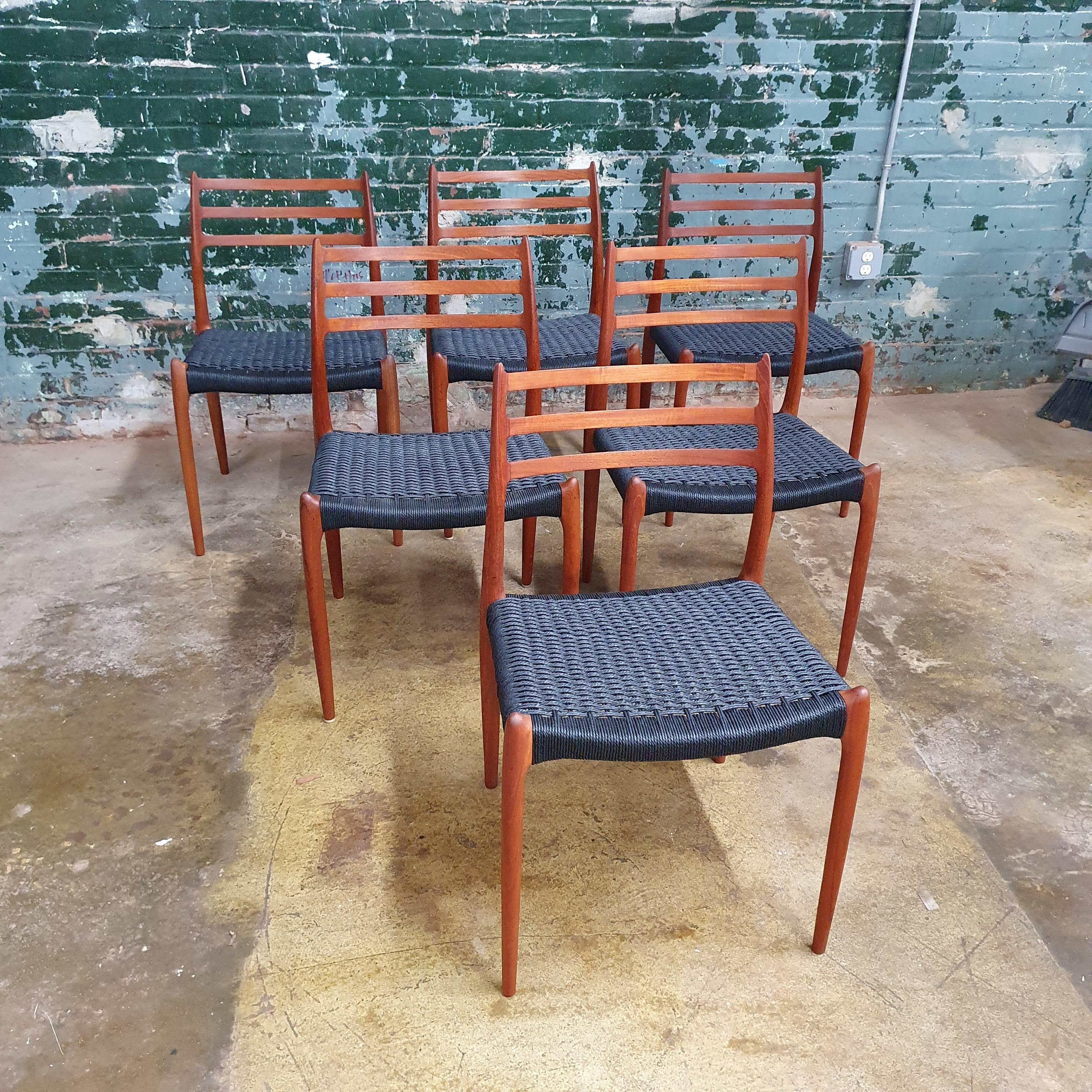 Beautiful set of 6 moller chairs, model 78 with new black danish cord. These chairs have been refinished and reoiled. There are some scratches and gouges in parts of the wood that give the excellent vintage patina while having the benefits of being