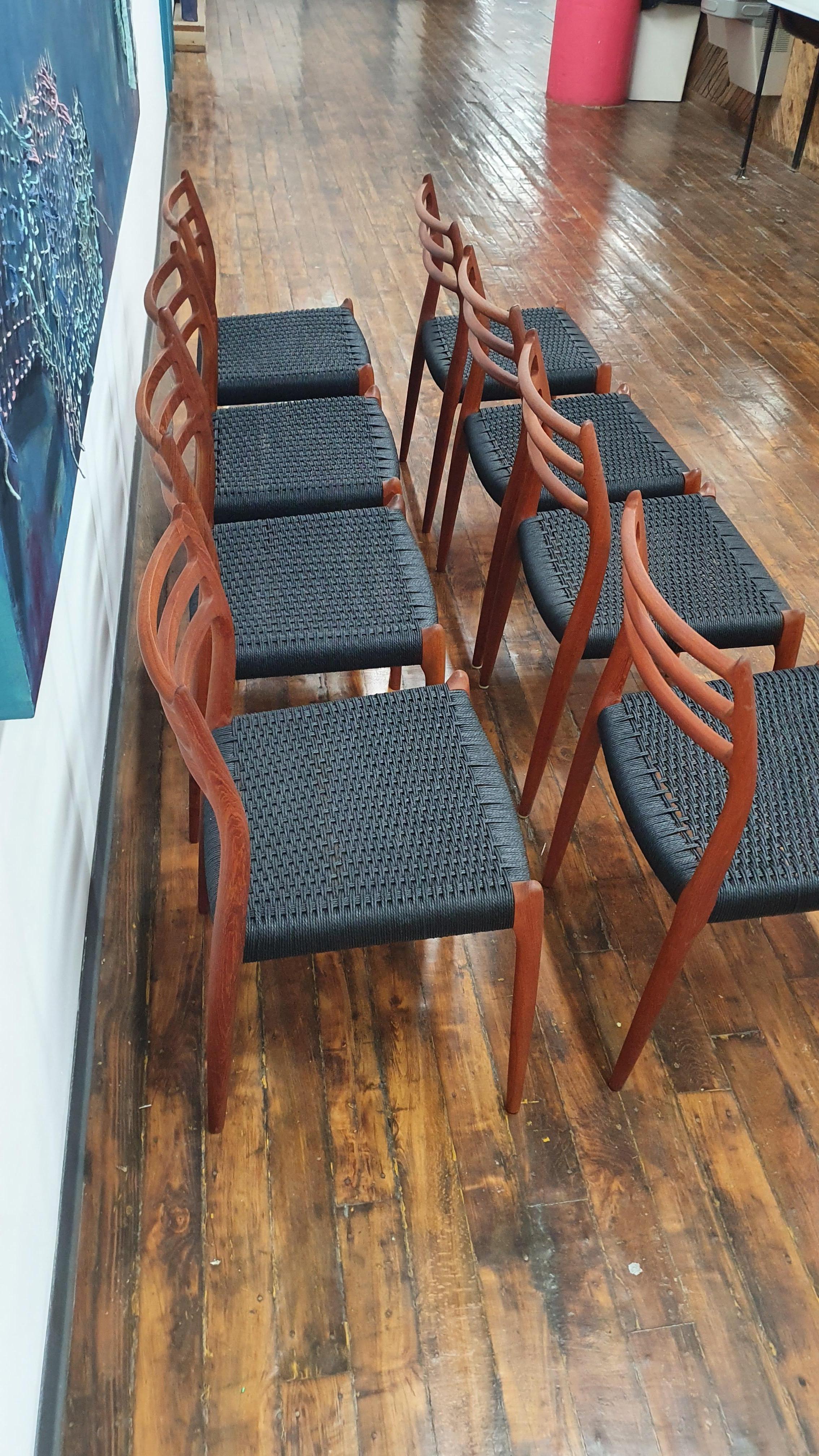 Beautiful set of 8 moller chairs, model 78 with new black danish cord. These chairs have been refinished and reoiled. There are some scratches and gouges in parts of the wood that give the excellent vintage patina while having the benefits of being