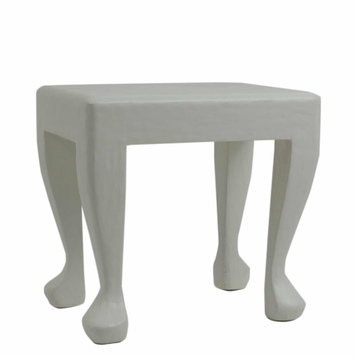 A white plaster / gesso occasional table in the style of John Dickinson's African series. USA, circa 1980.