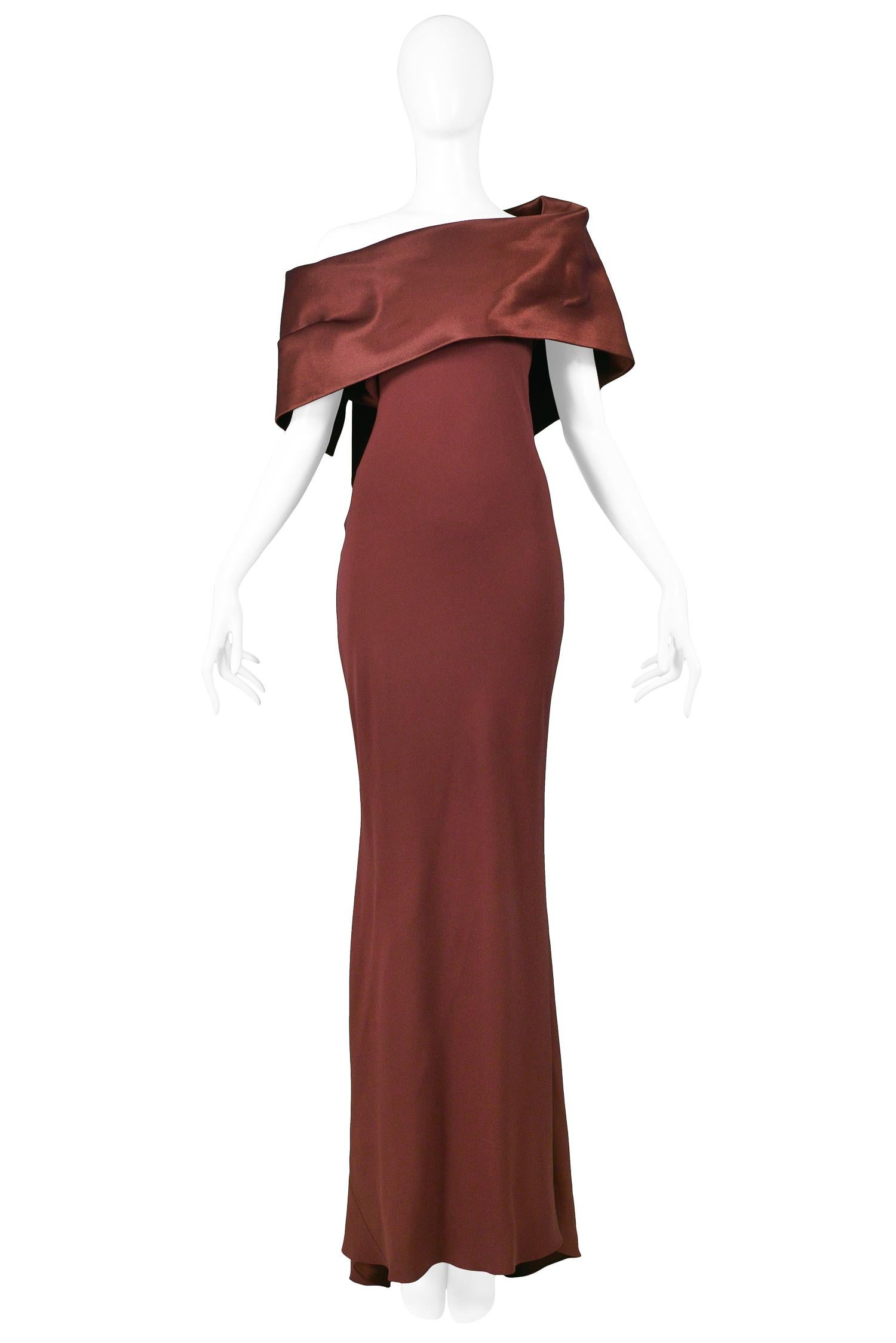 Vintage John Galliano aubergine satin bias-cut asymmetrical cold shoulder gown with attached bodice overlay and bias hem. 

Excellent Vintage Condition.

Size: 44