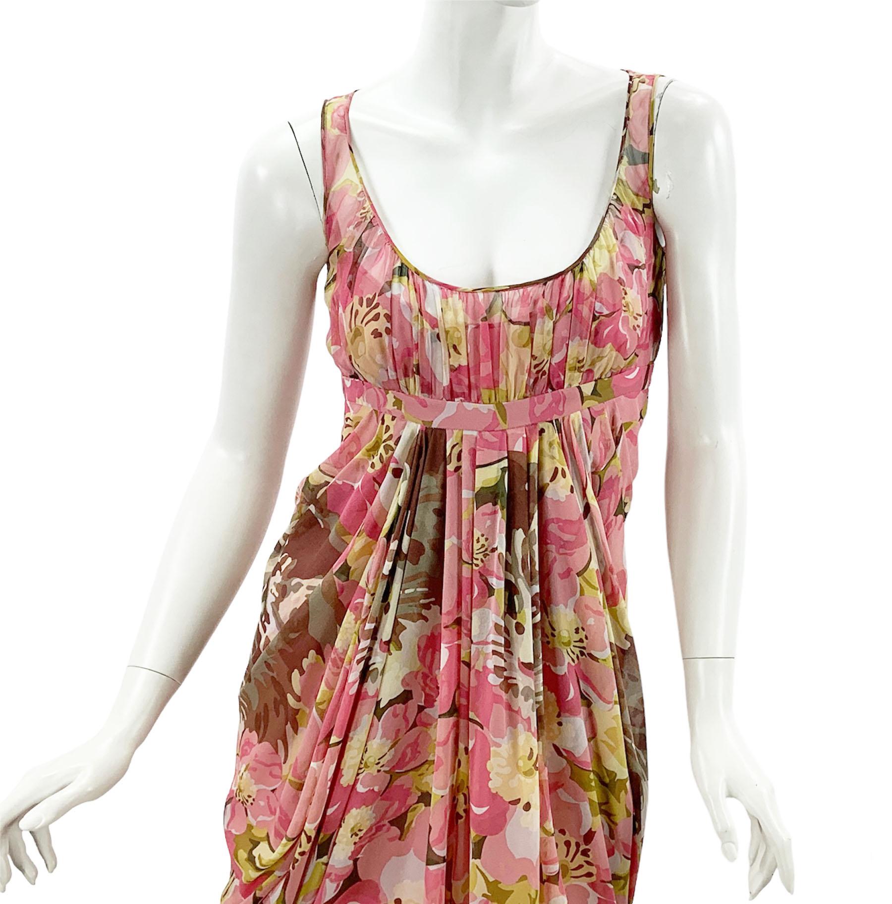 Vintage John Galliano Silk Floral Print Pleated Dress
French size 36 - US 4
2007 Collection
100% Silk dress and lining, Floral print, Pleated details, Empire waist, Fabric-covered button closure.
Measurements: Length - 40 inches, Bust - 32/34