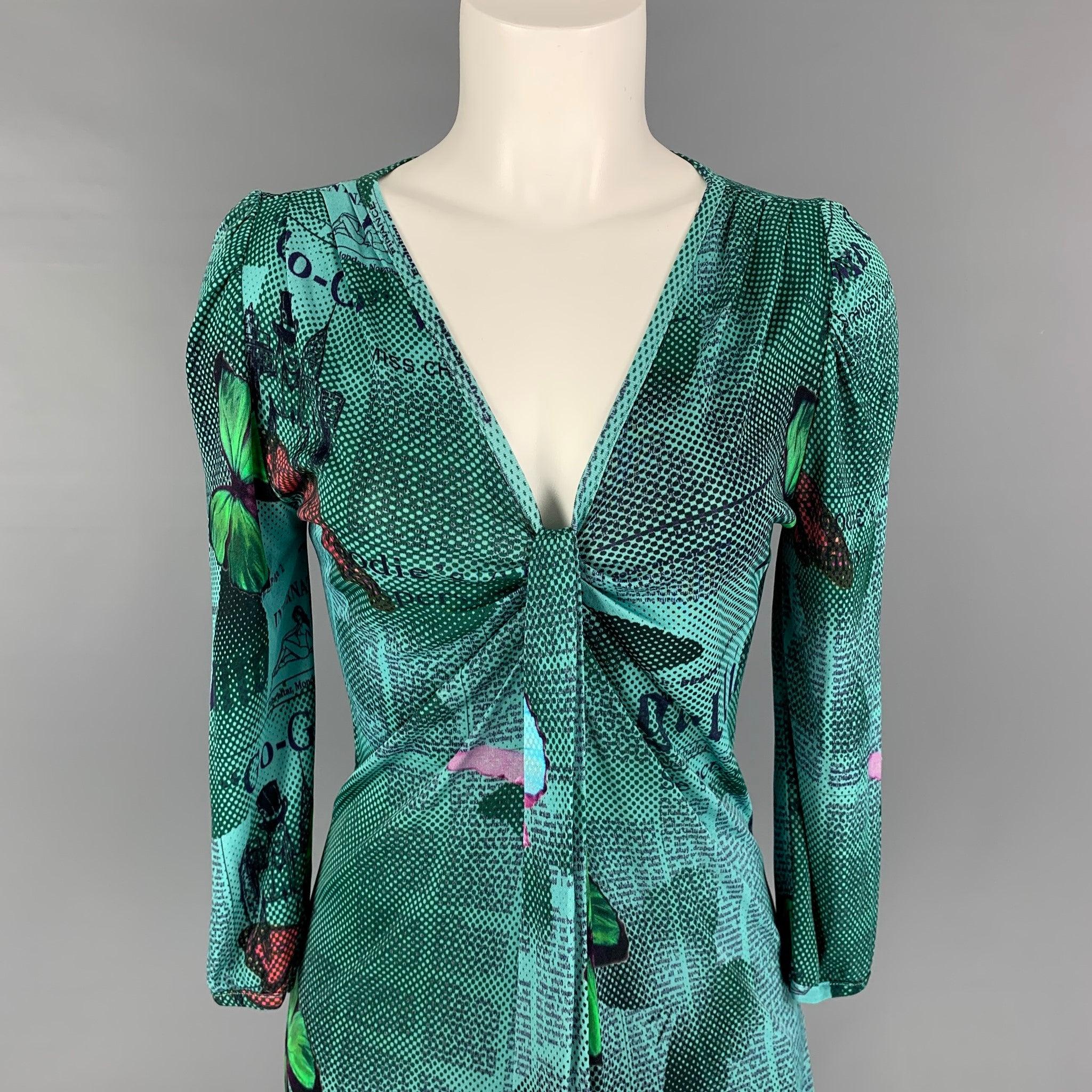 Vintage JOHN GALLIANO blouse comes in a multi-color jersey 'Gazette Newsprint' viscose featuring a front ruched design and a v-neck. Made in Italy.
Excellent
Pre-Owned Condition. 

Marked:   XS 

Measurements: 
 
Shoulder: 14 inches  Bust: 32 inches