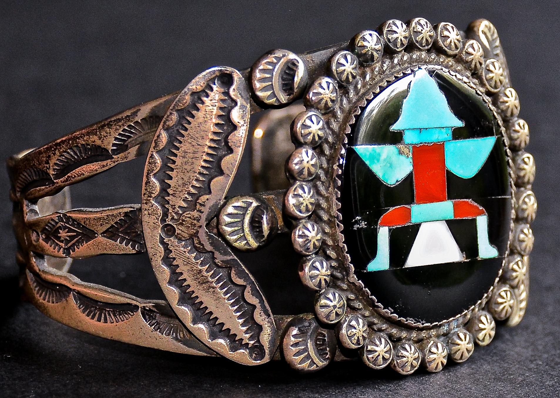 Strikingly beautiful historic Knife Wing design inlaid sterling silver cuff bracelet set with natural turquoise, spiny oyster shell, and mother of pearl inlaid into a black jet background. Made by the Zuni Master John Gordon Leak, also known as J.