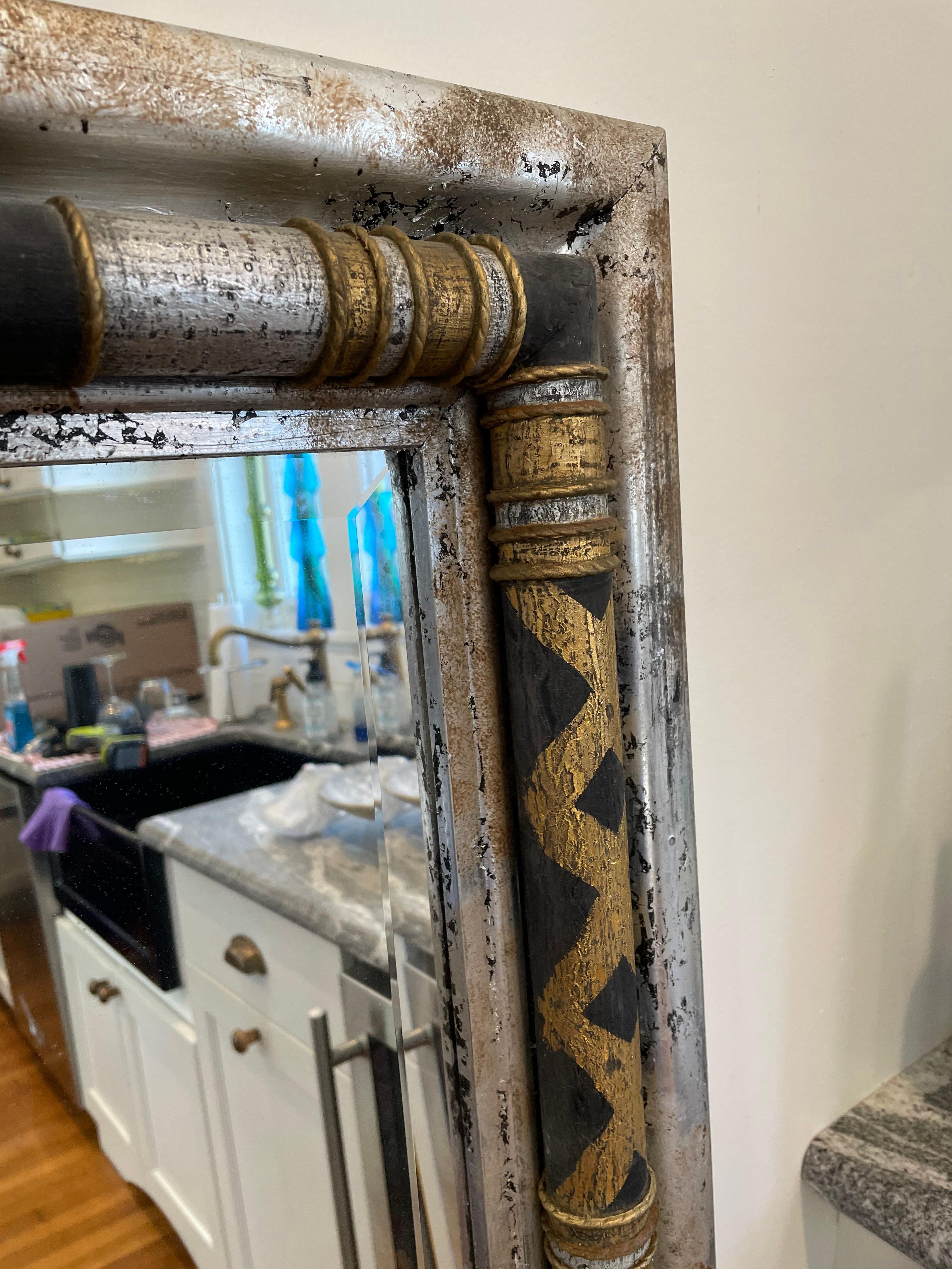 Stunning John-Richard decorative wall mirror with a modern twist on neoclassical design. Silver fleck finish adorned with black and gold harlequin columns. Striking presence that packs a punch!
Curbside to NYC/Philly $300