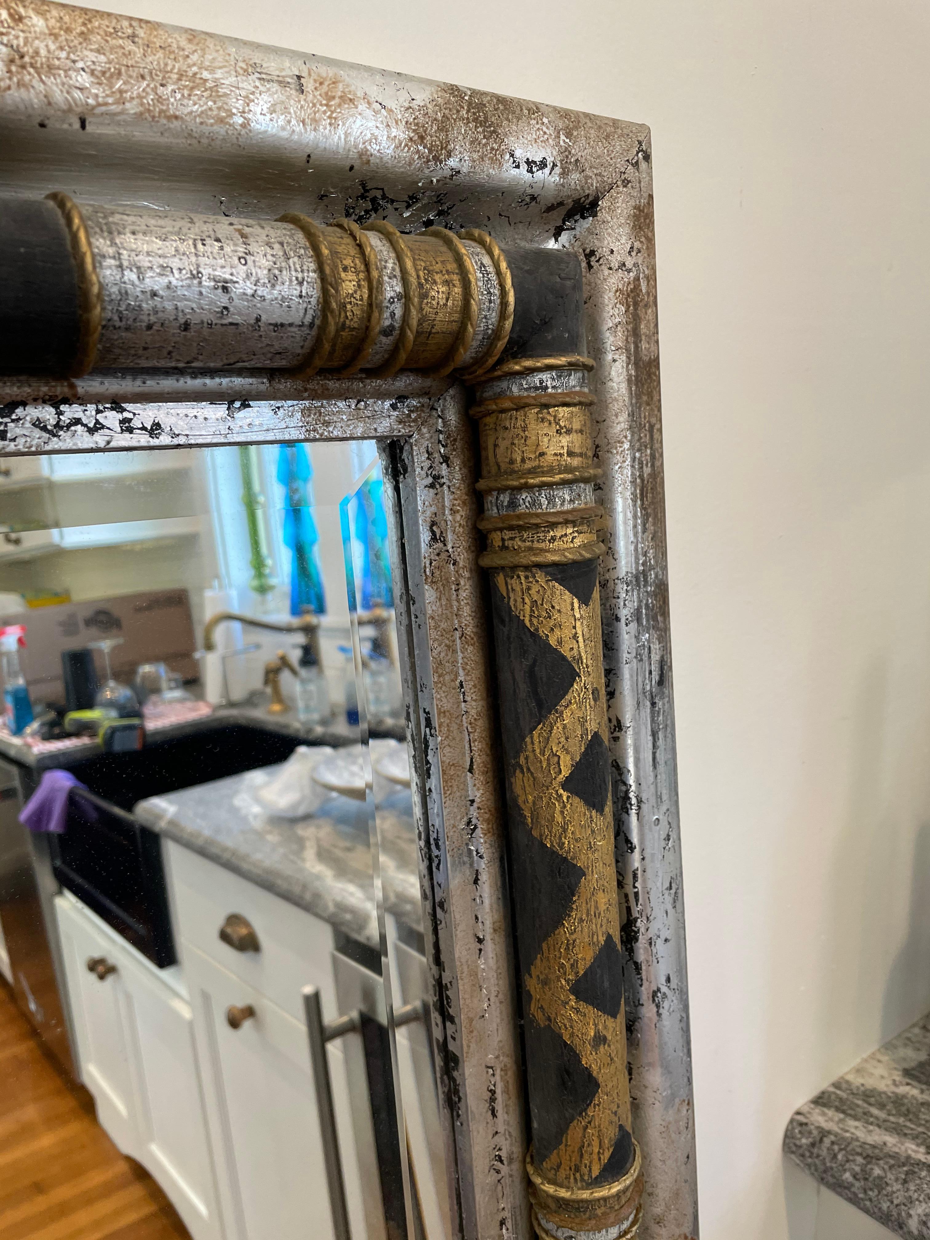 Stunning John-Richard decorative wall mirror with a modern twist on neoclassical design. Silver fleck finish adorned with black and gold harlequin columns. Striking presence that packs a punch!
Curbside to NYC/Philly $450