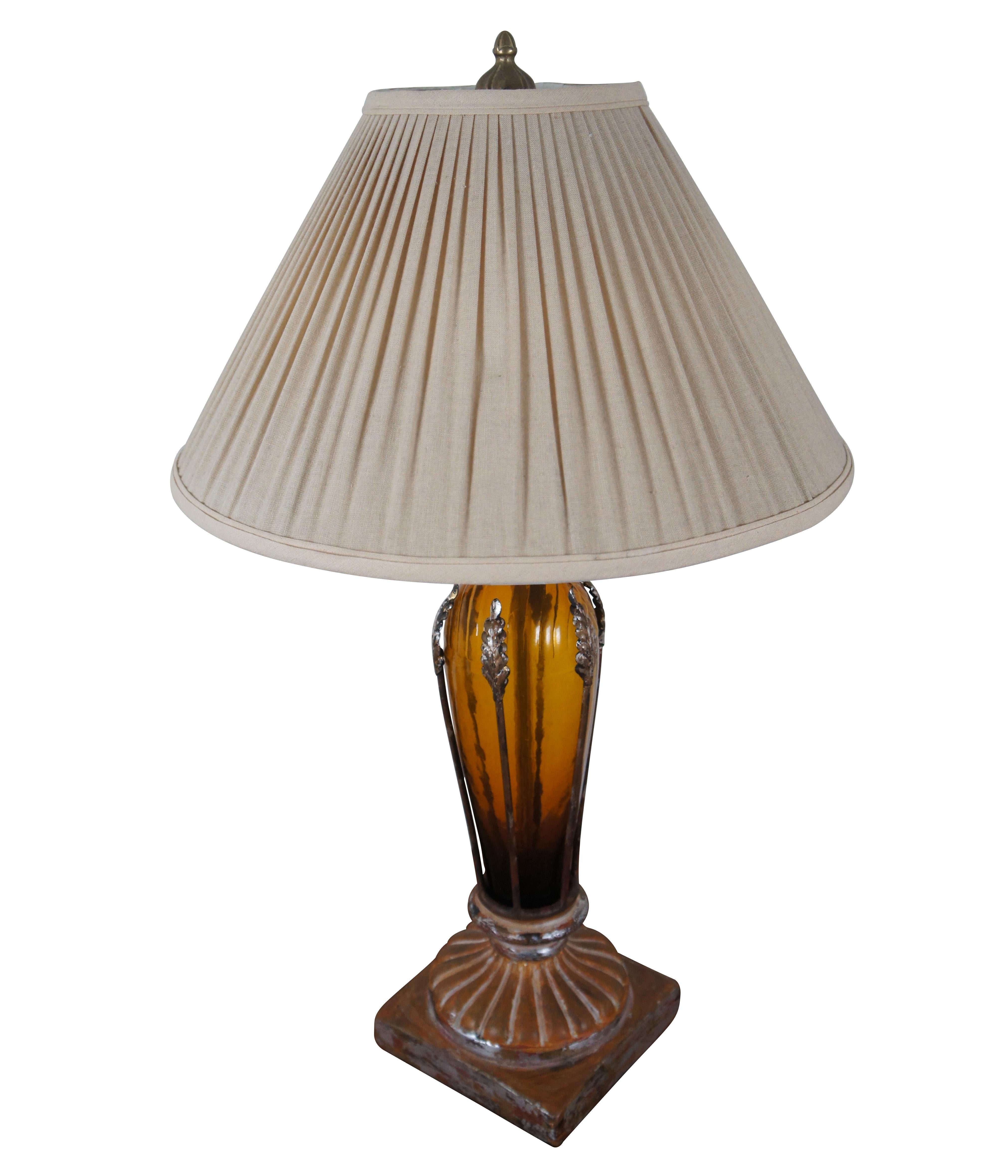 Vintage John Richard neoclassically inspired table lamp with painted chalkware column base supporting an amber glass trophy urn shaped vase topped with gold and caged with single leaf stalks. Off white, pleated linen shade. JRL5295 Amber and Gold