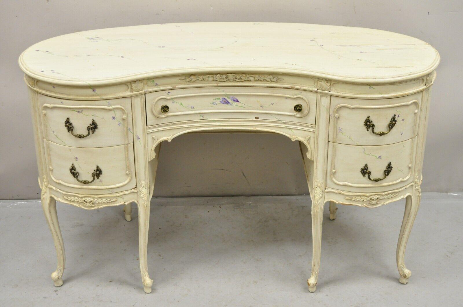 Vintage John Stuart White Painted French Louis XV Kidney Shaped Vanity and Bench. Item features hand painted purple flower and green vine accents, 5 drawers, shapely cabriole legs, painted finished back, matching vanity bench, original label, great