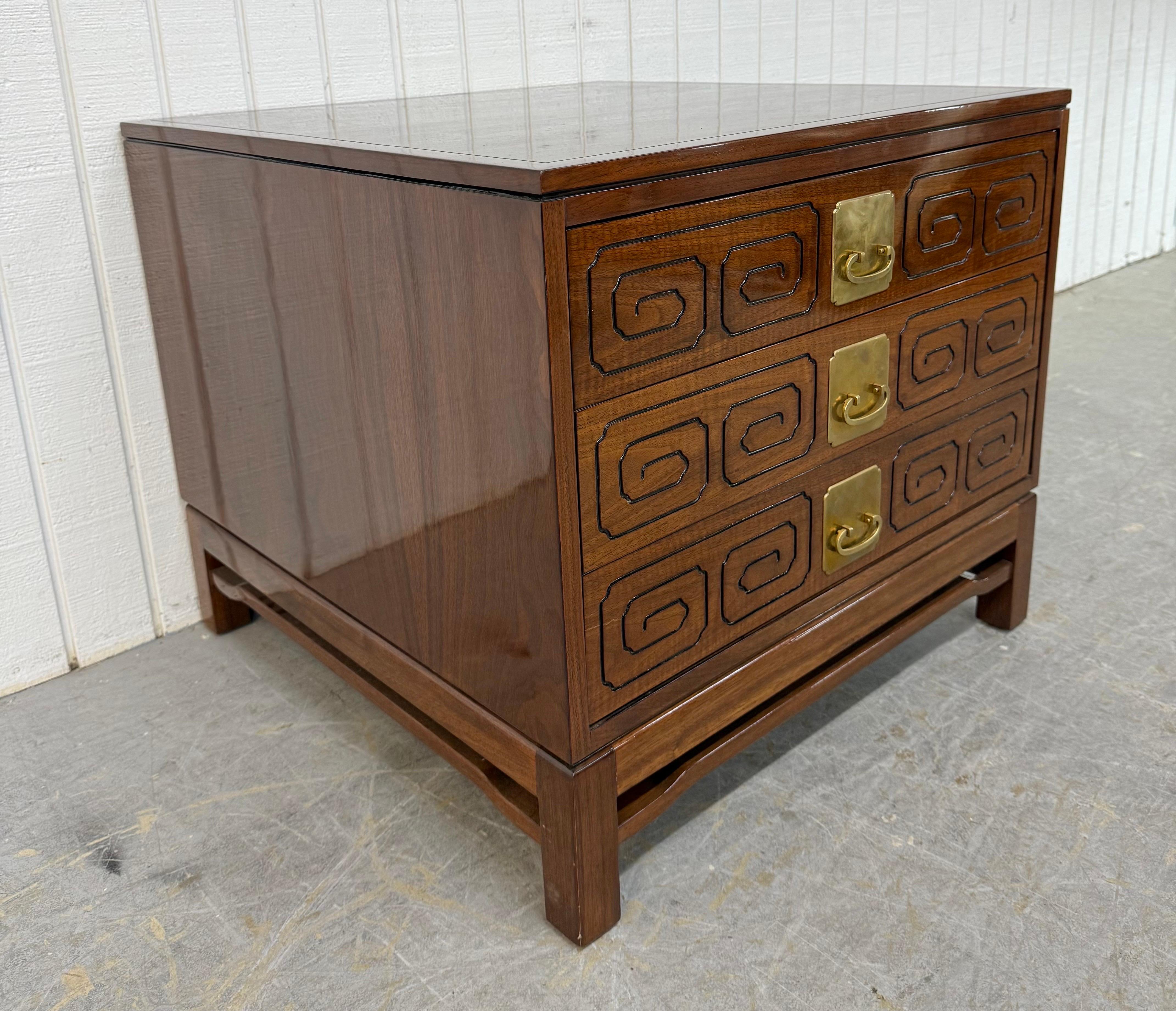 This listing is for a Vintage John Widdicomb Campaign Walnut Chest. Featuring a straight line cube design, three drawers with campaign style brass hardware, modern legs, and a beautiful walnut finish. This is an exceptional combination of quality