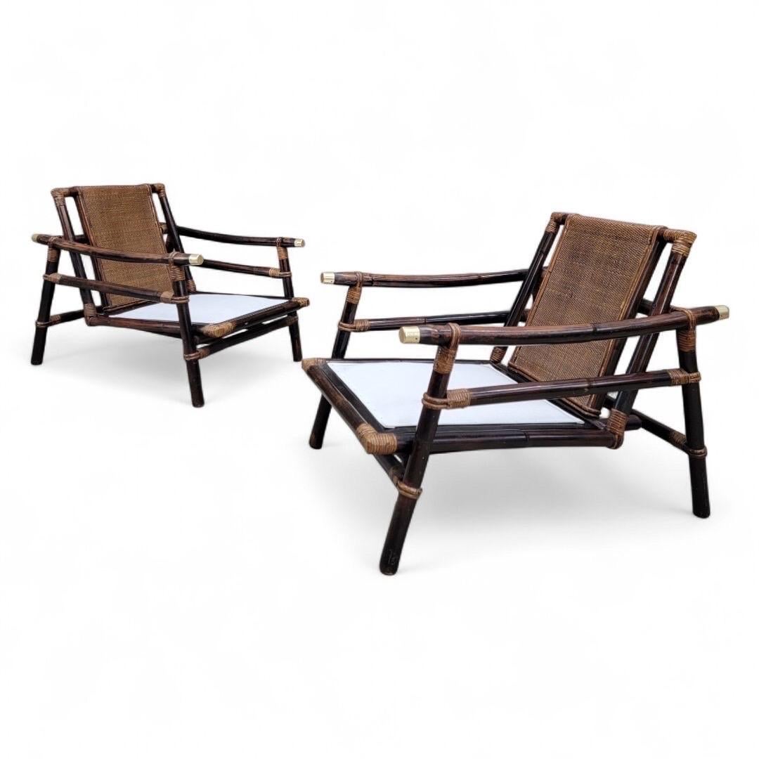 Juego de 2 sillones pagoda de ratán y bambú estilo campaña vintage John Wisner para Ficks Reed, con acabado en latón

Este fantástico conjunto de sillas para patio tiene un respaldo tejido, una estructura de bambú y un acabado de latón. Decora tu