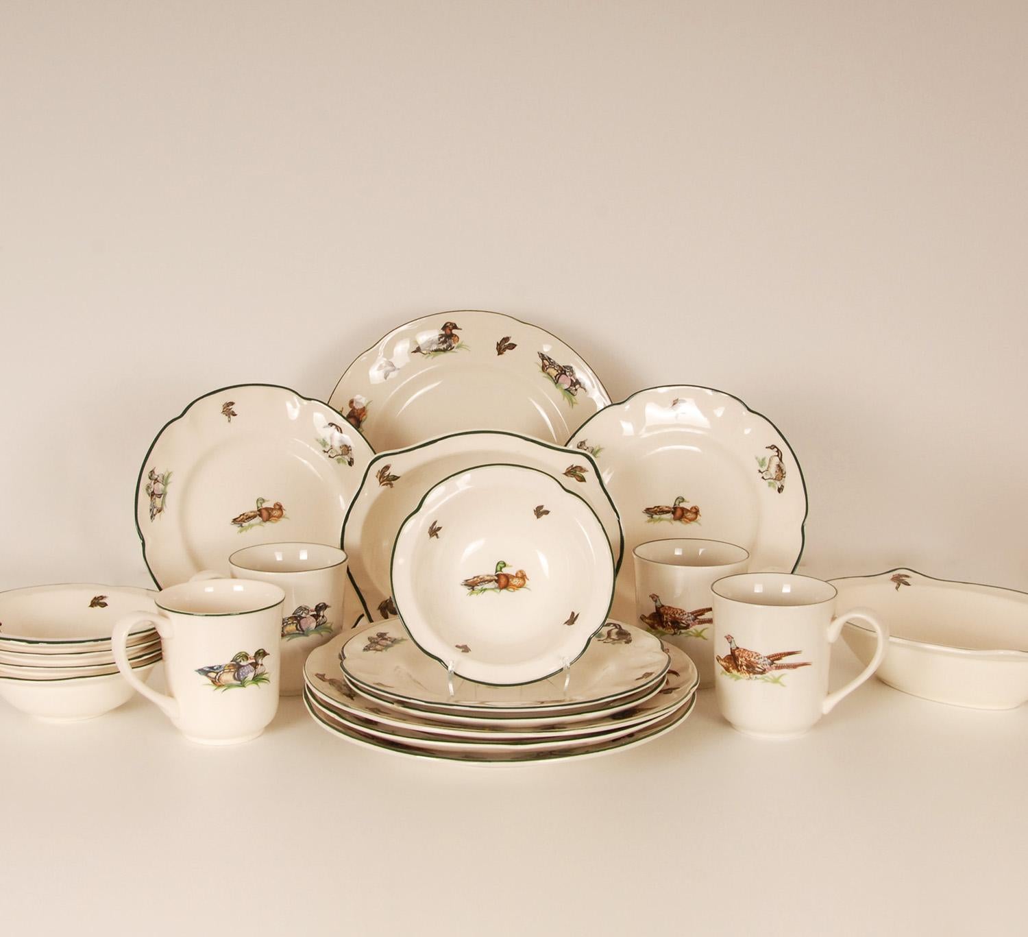 Stunning English fabulous porcelain - Bone China Dinner or Luncheon set from Johnson Brothers.
Decorated with the much coveted Brookshire pattern.
Fabulous featured with Ducks and pheasants. All the pieces are green trimmed. 
The set includes
- 4