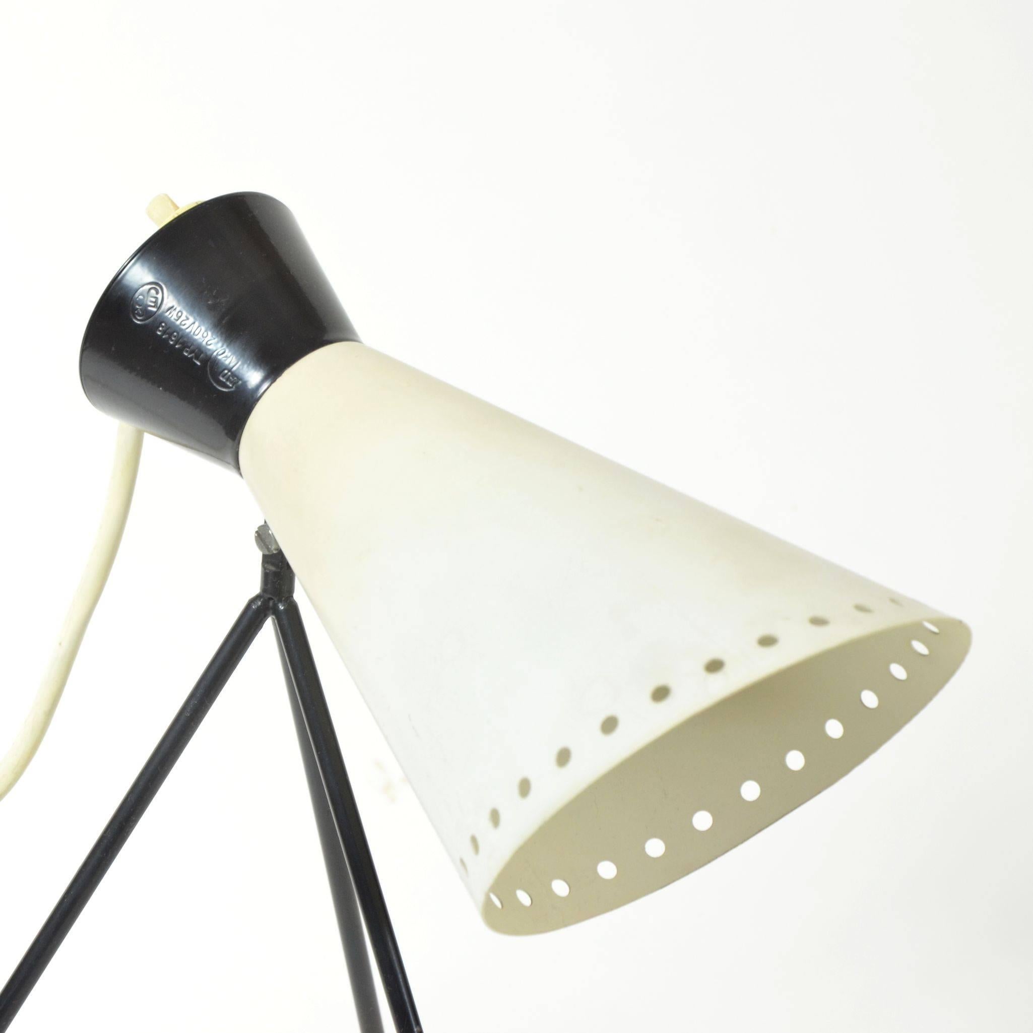 Unique vintage table lamp by lesser known Czech industrial designer, Josef Hurka for Napako. The enameled red tripod base effortlessly supports the bright, conical metal shade. Lamp is in very good, original condition with no essential harms. Some