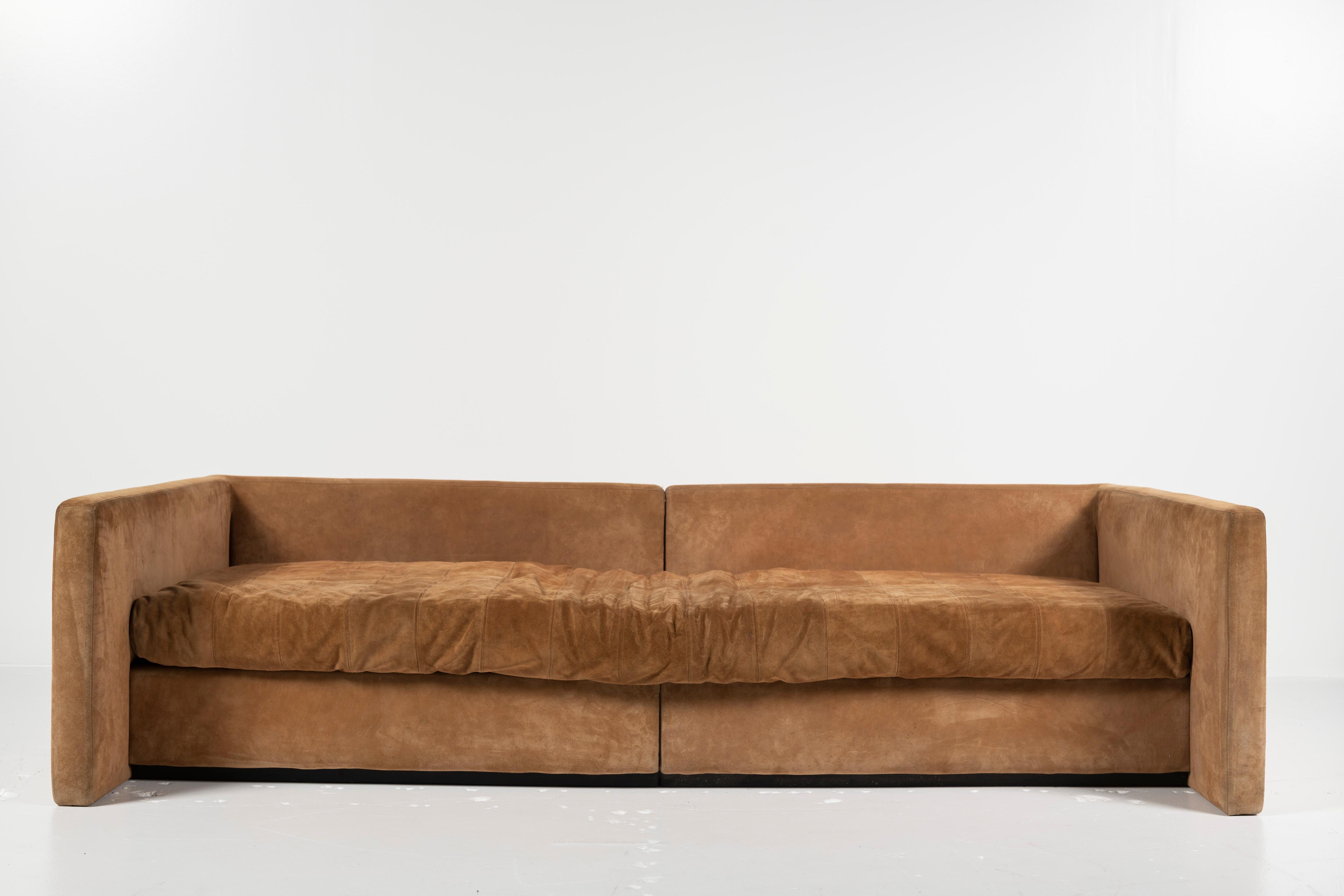 This iconic and comfortable Joe D'Urso sofa for Knoll has enjoyed many a cocktail party, movie night and nap! It's in solid condition though the nubuck upholstery needs either a deep cleaning or an upgrade. Upcycle this great piece for a modern and