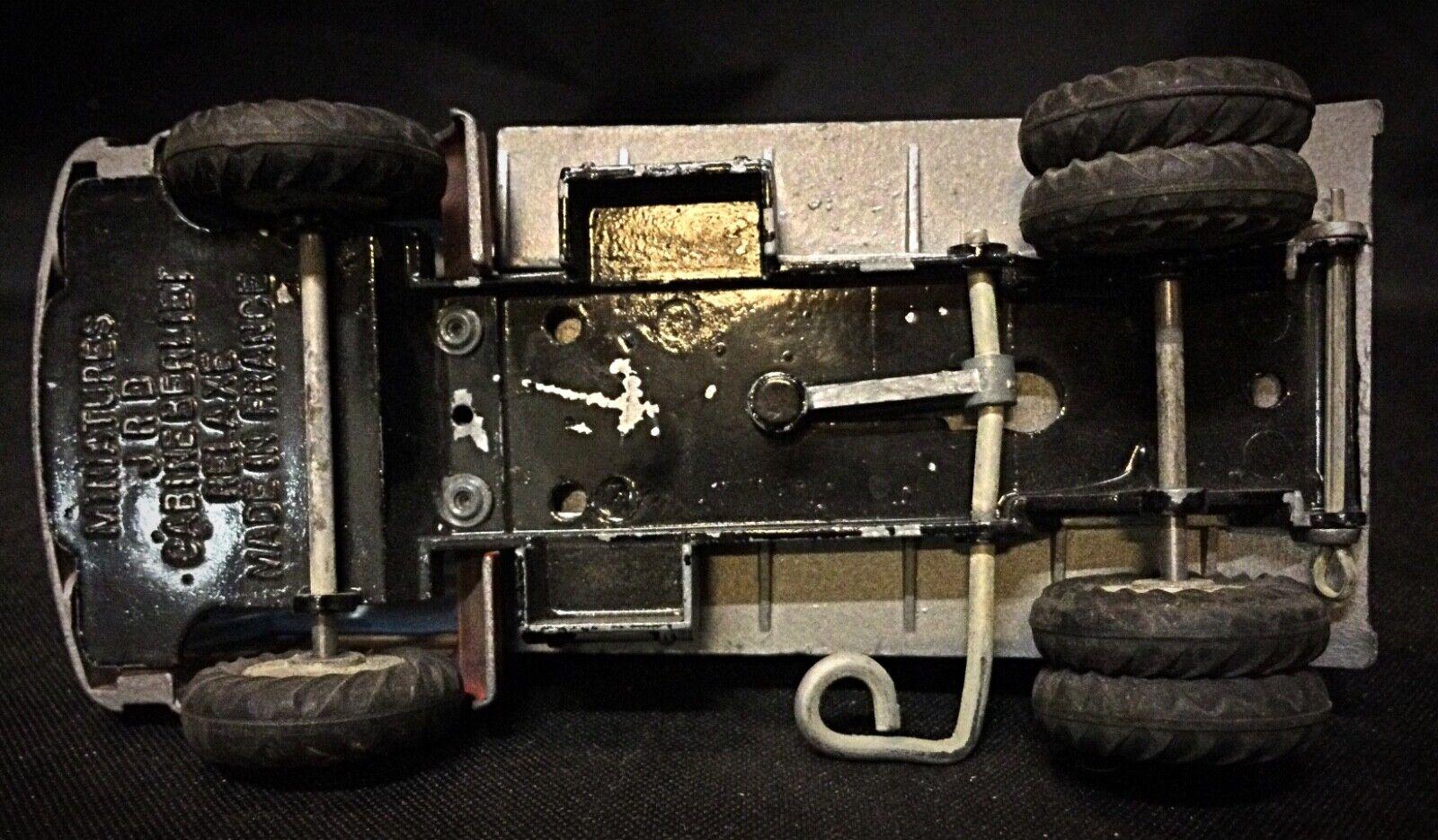 Explore a piece of vintage transportation history with this classic JRD Berliet Relaxe truck. This small collectible features a Berliet cab and is a testament to mid-20th-century toy design. The truck is in used condition with the paint generally