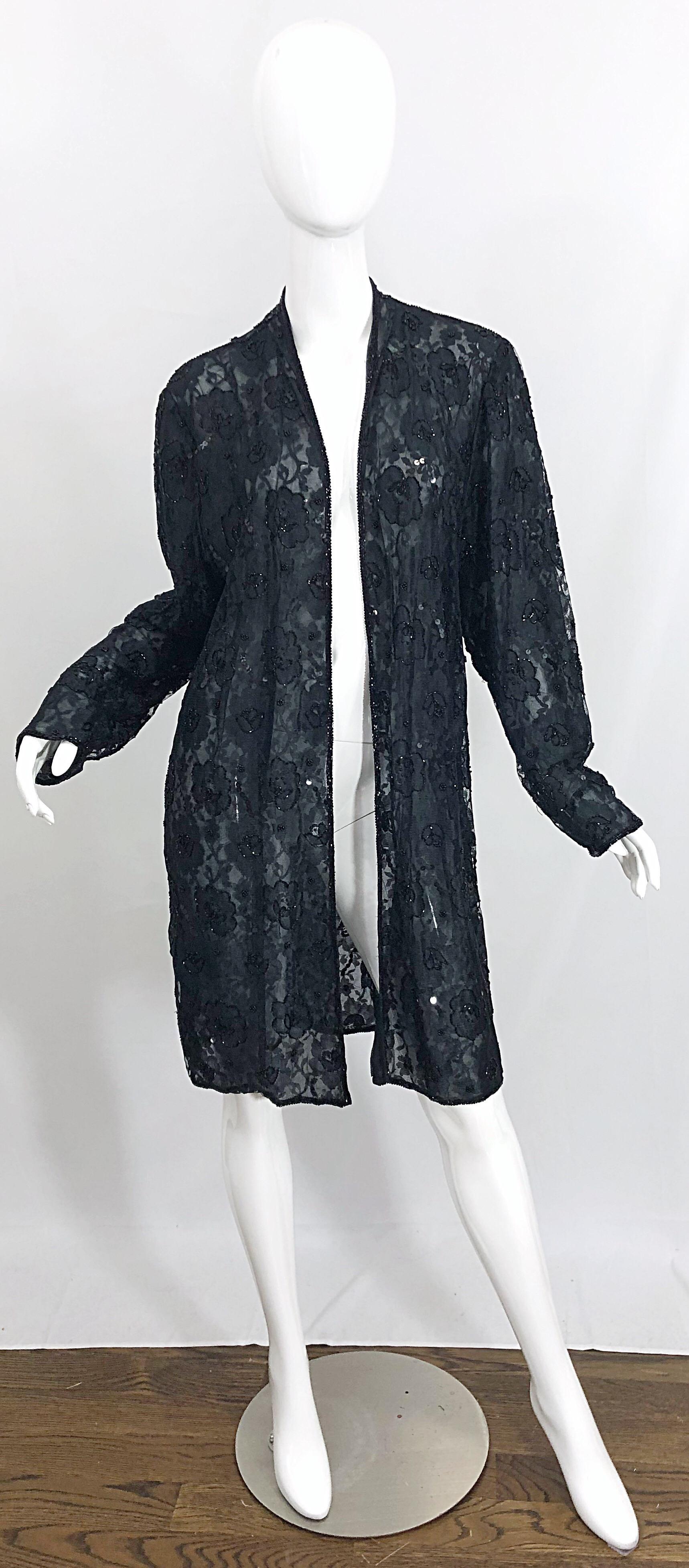 The perfect finishing piece! Beautiful vintage JUDITH ANN black rayon lace beaded sheer duster jacket / cardigan! Features a double-ply black sheer lace. Thousands of hand-sewn beads throughout. Great layering piece that can easily be dressed up or