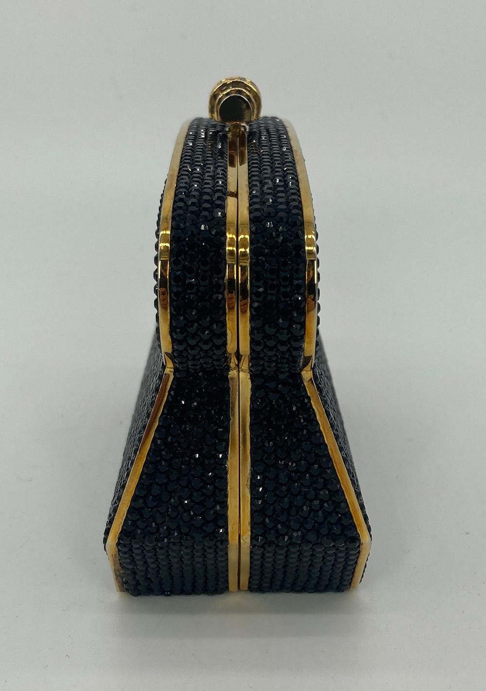 Judith Leiber Black Crystal Bread Loaf Minaudiere in excellent condition. Black crystal exterior trimmed with gold hardware and top button closure. Gold leather interior with attached gold chain shoulder strap. Overall excellent condition no stains