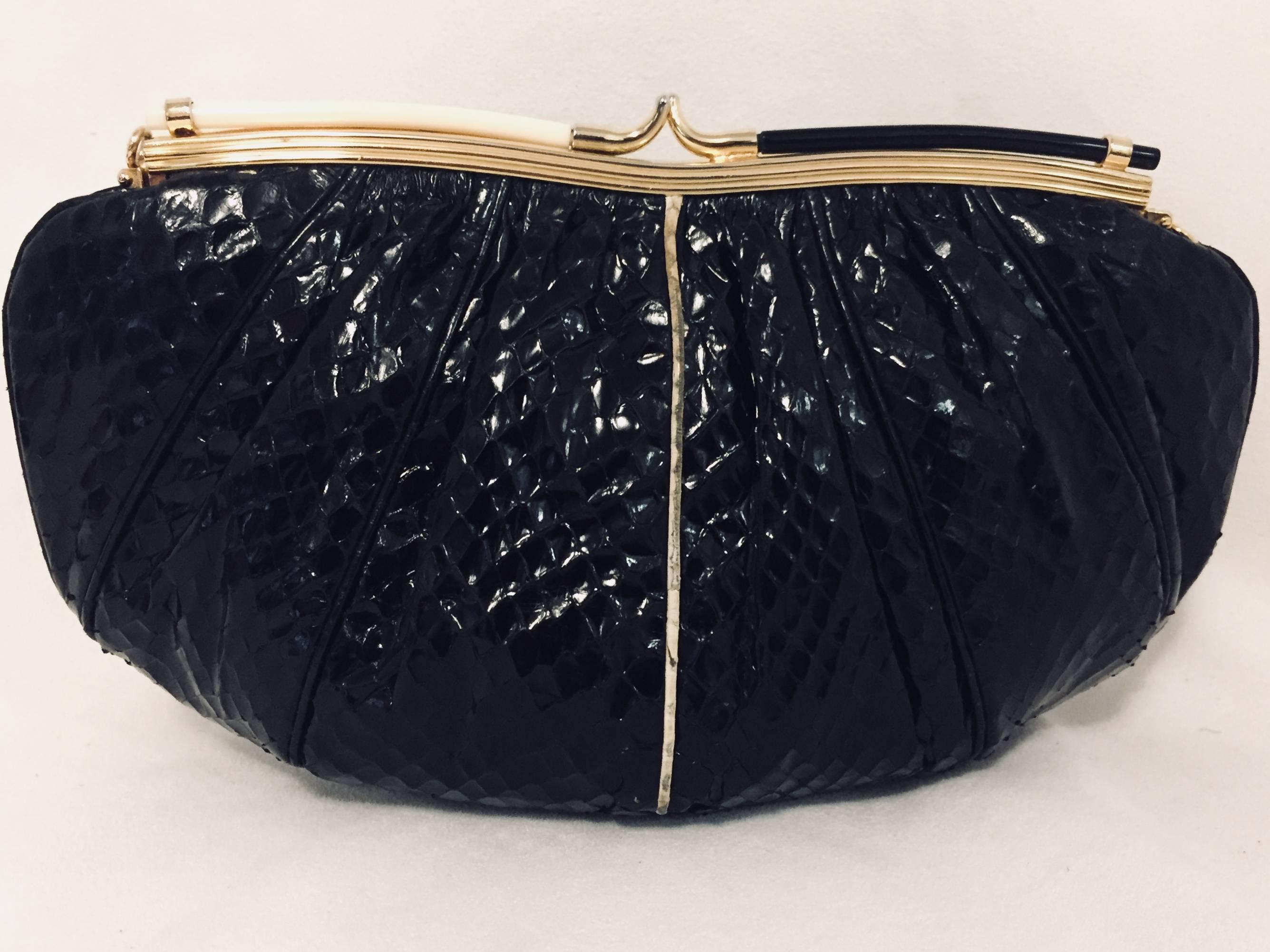 Vintage Black Evening Bag is highly desired by all collectors of Judith Leiber!  Featuring gold tone hardware and slightly gathered, butter-soft python allover, bag easily converts from clutch to shoulder bag using python strap with minimal effort!